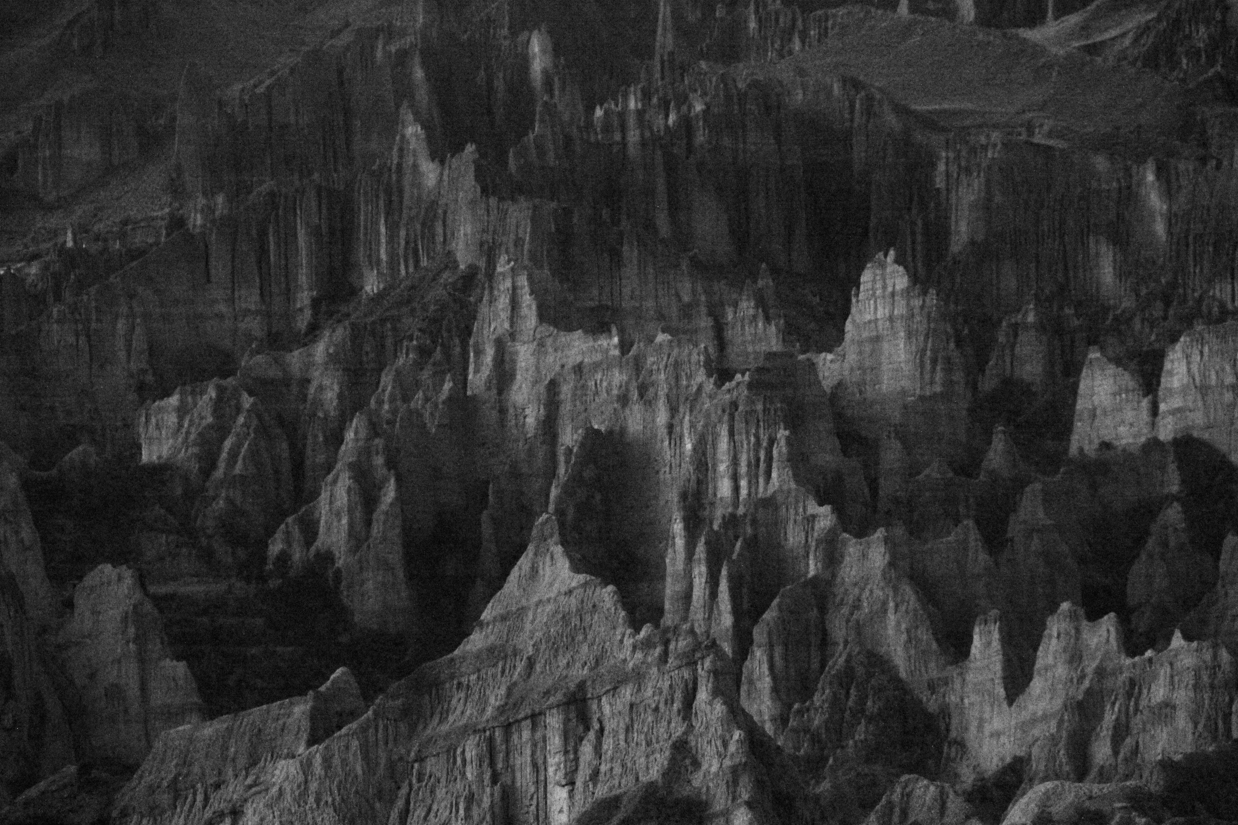 Stunning black and white depiction of dramatic cliff formations in La Paz, Bolivia.