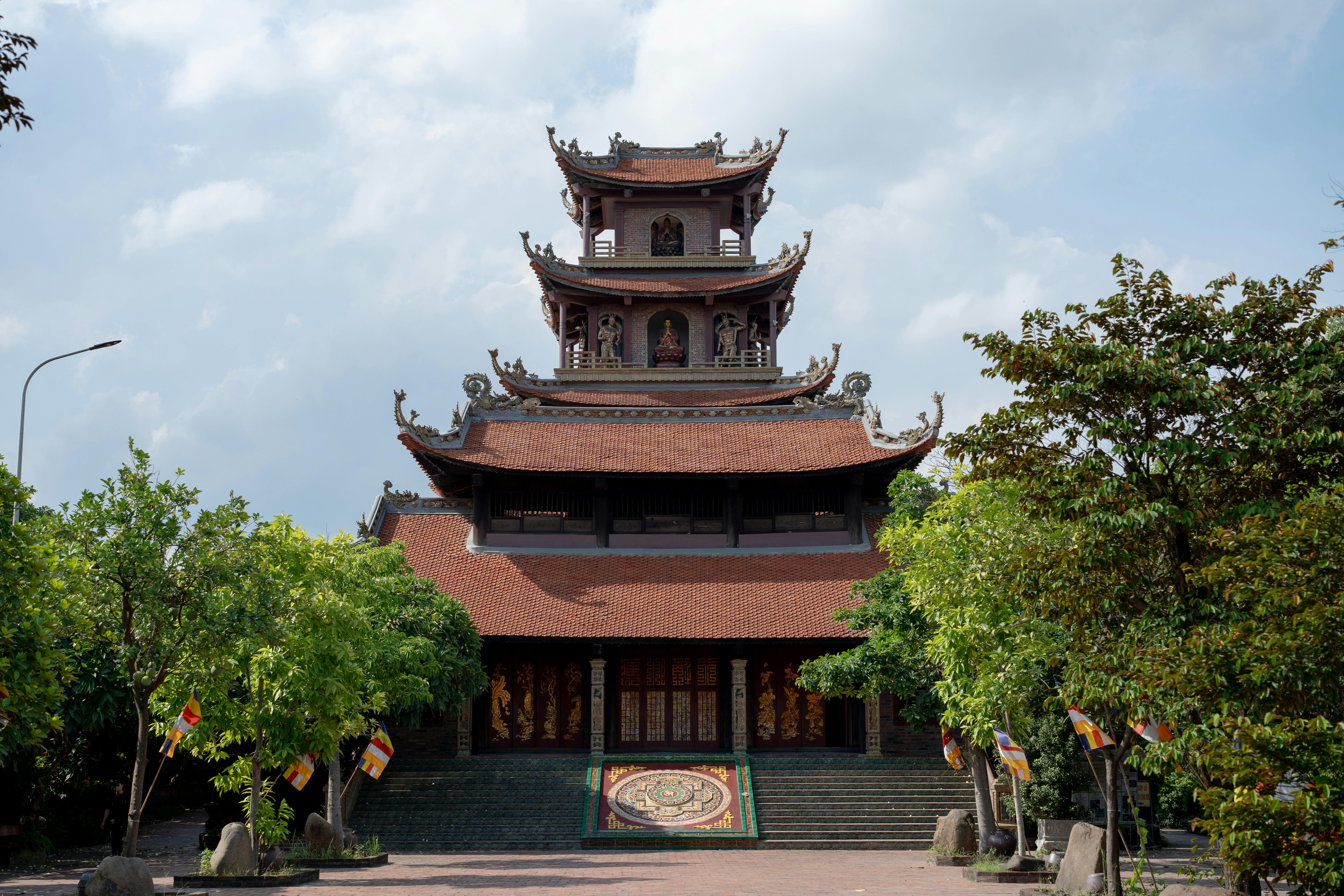 A traditional pagoda surrounded by vibrant trees, showcasing cultural architecture.