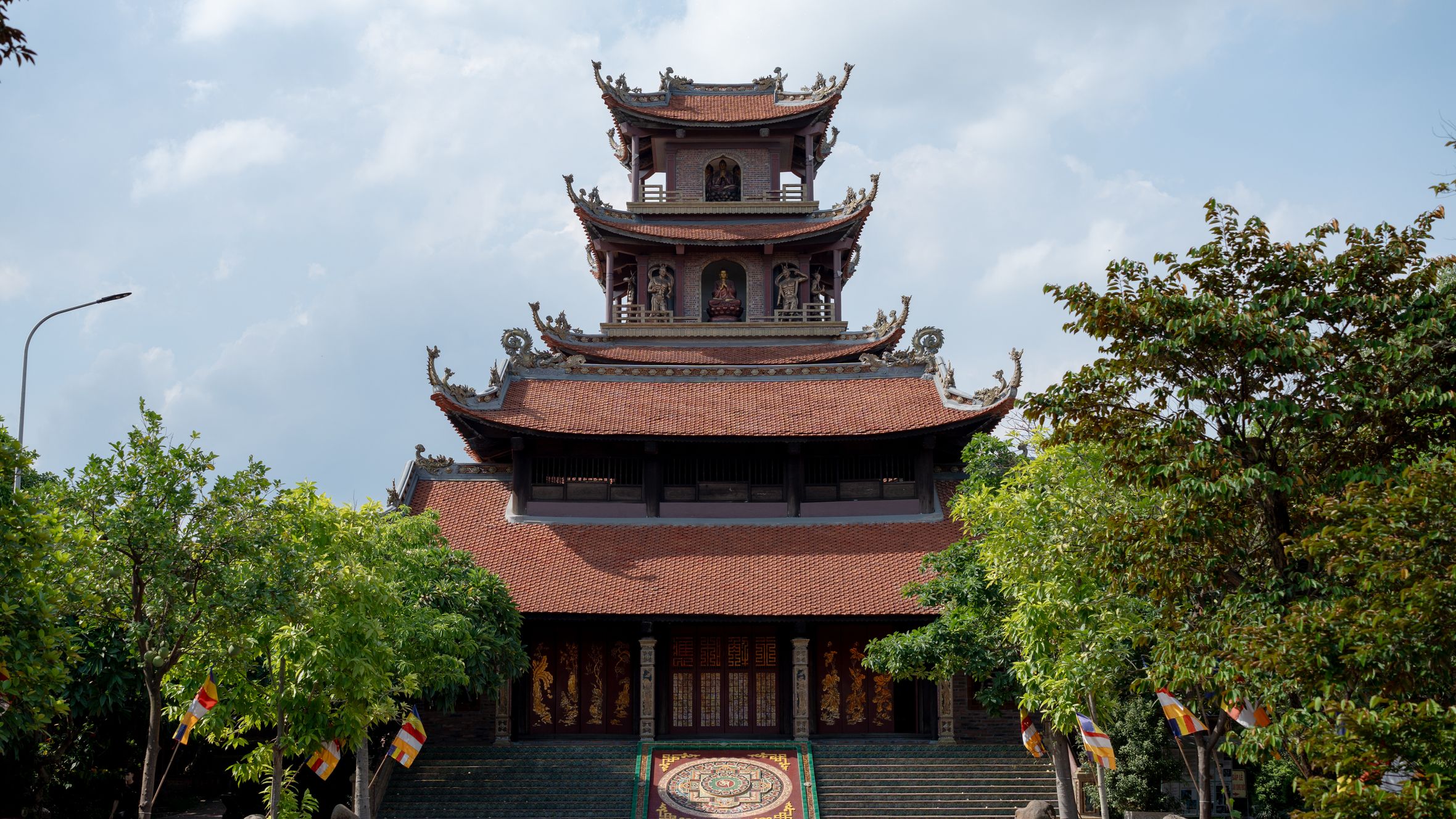 A traditional pagoda surrounded by vibrant trees, showcasing cultural architecture.