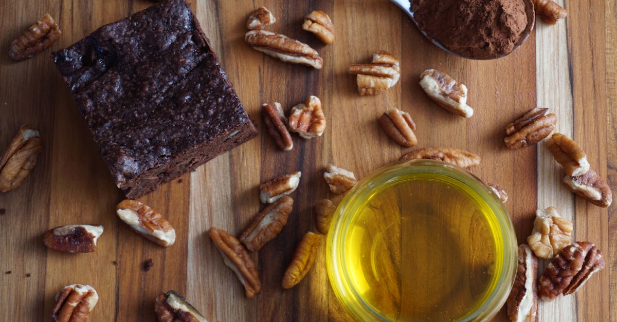 Flat lay of homemade chocolate brownie with pecans, cocoa, and oil. Perfect for baking visuals. - Evidence evidence guide for cacao-flavanol-stress-randomized-trial