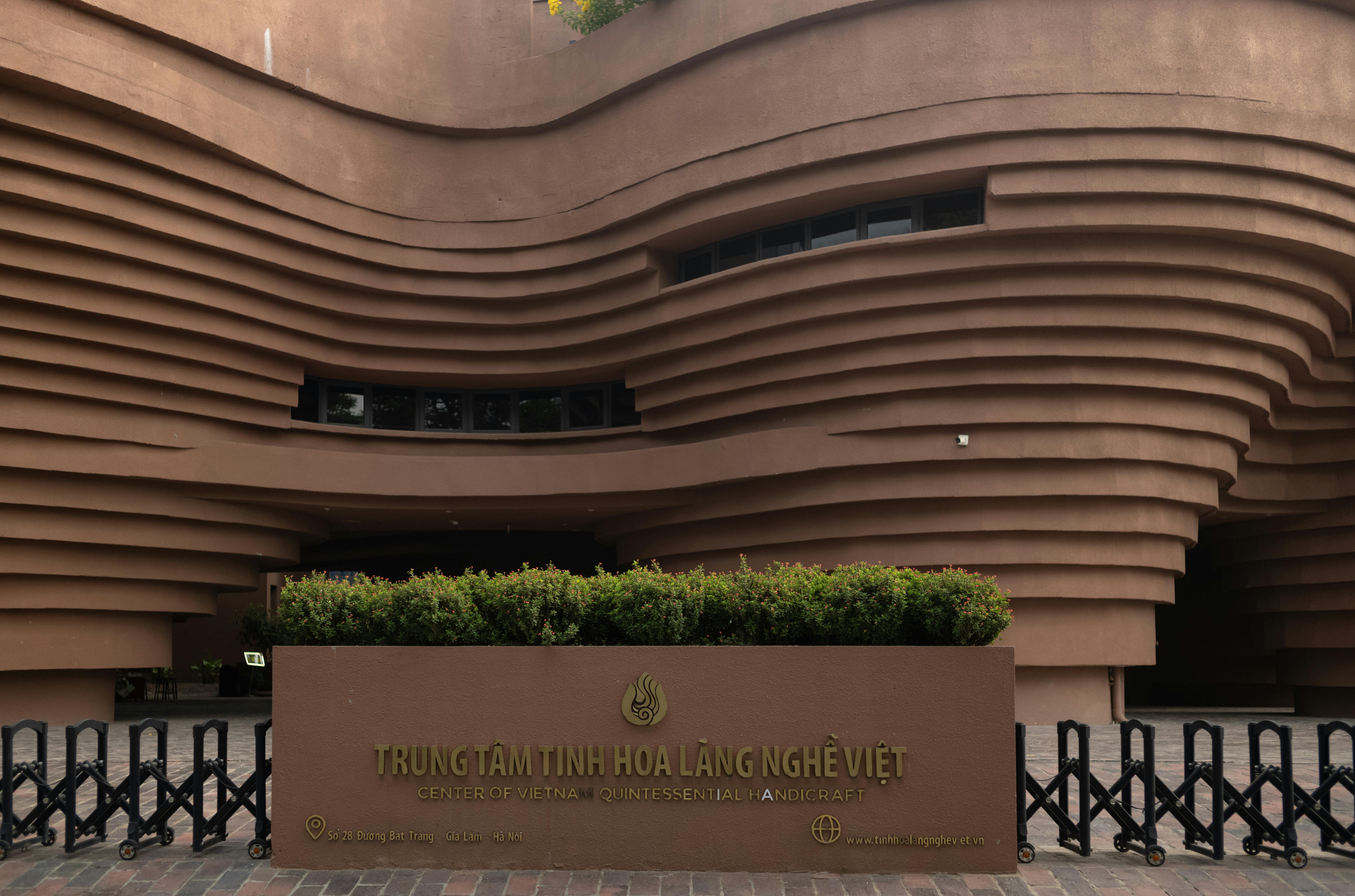 The Center of Vietnam Quintessential Handicraft showcases modern architectural design with wave-like patterns.
