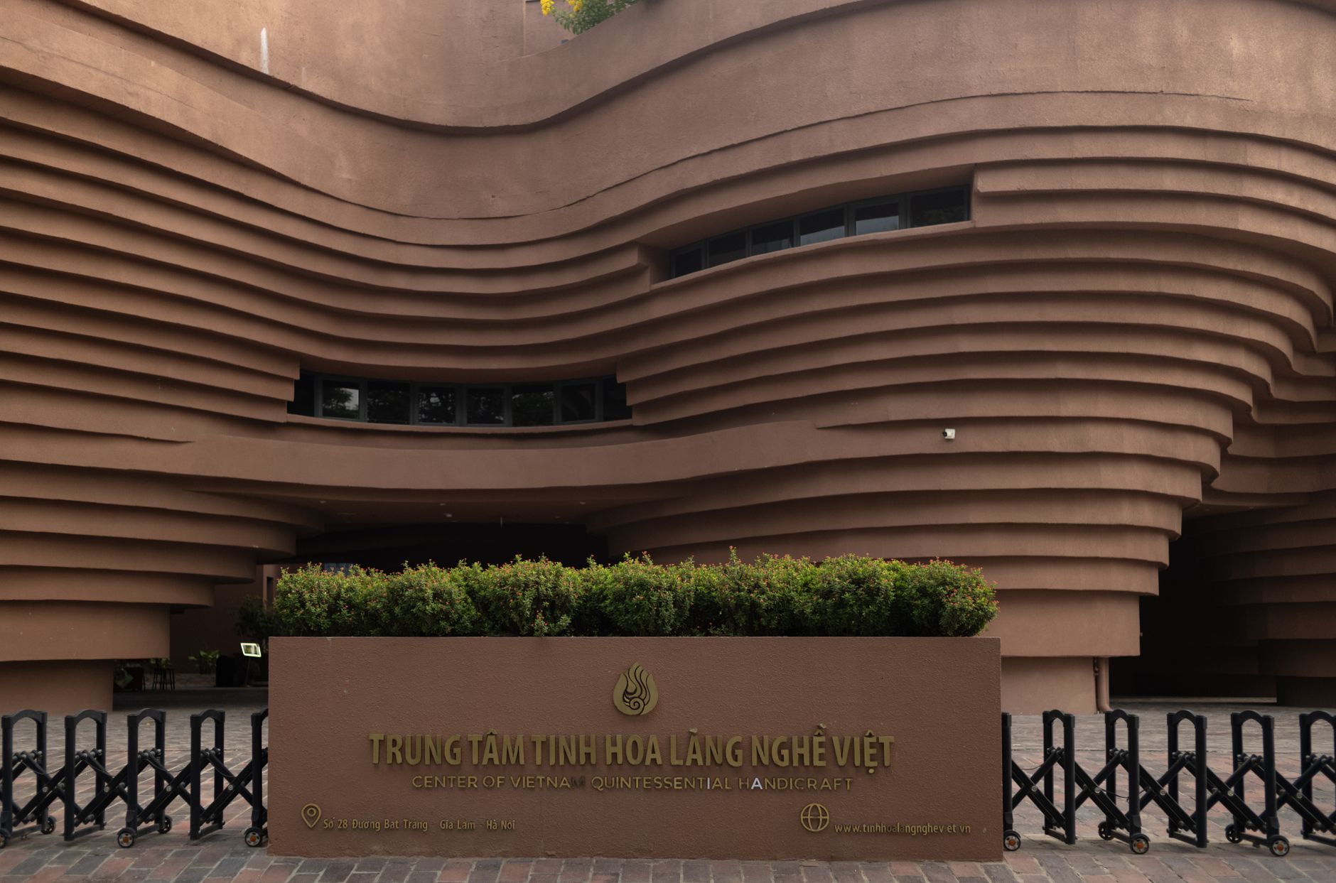 The Center of Vietnam Quintessential Handicraft showcases modern architectural design with wave-like patterns.