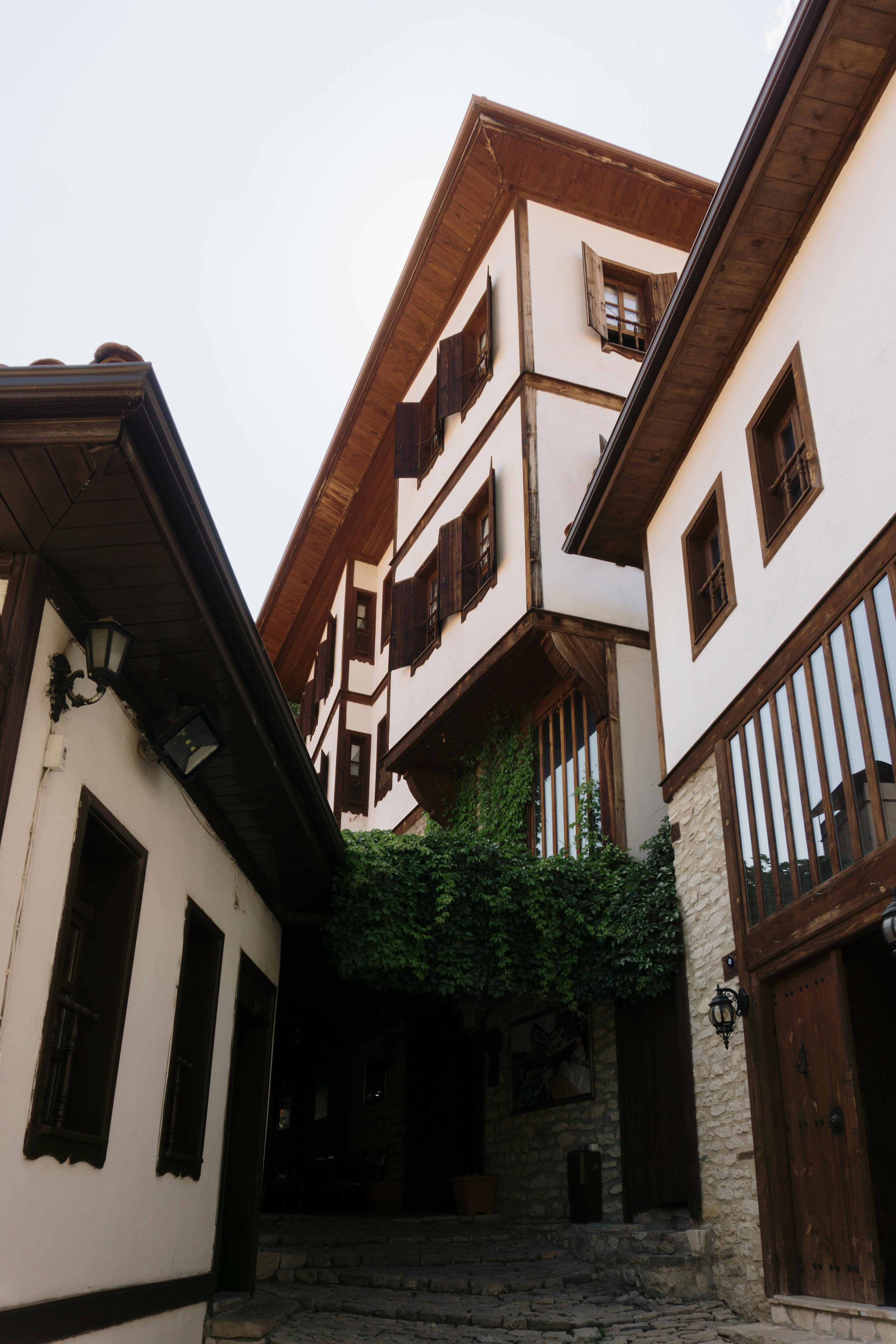 a narrow street with a building on both sides