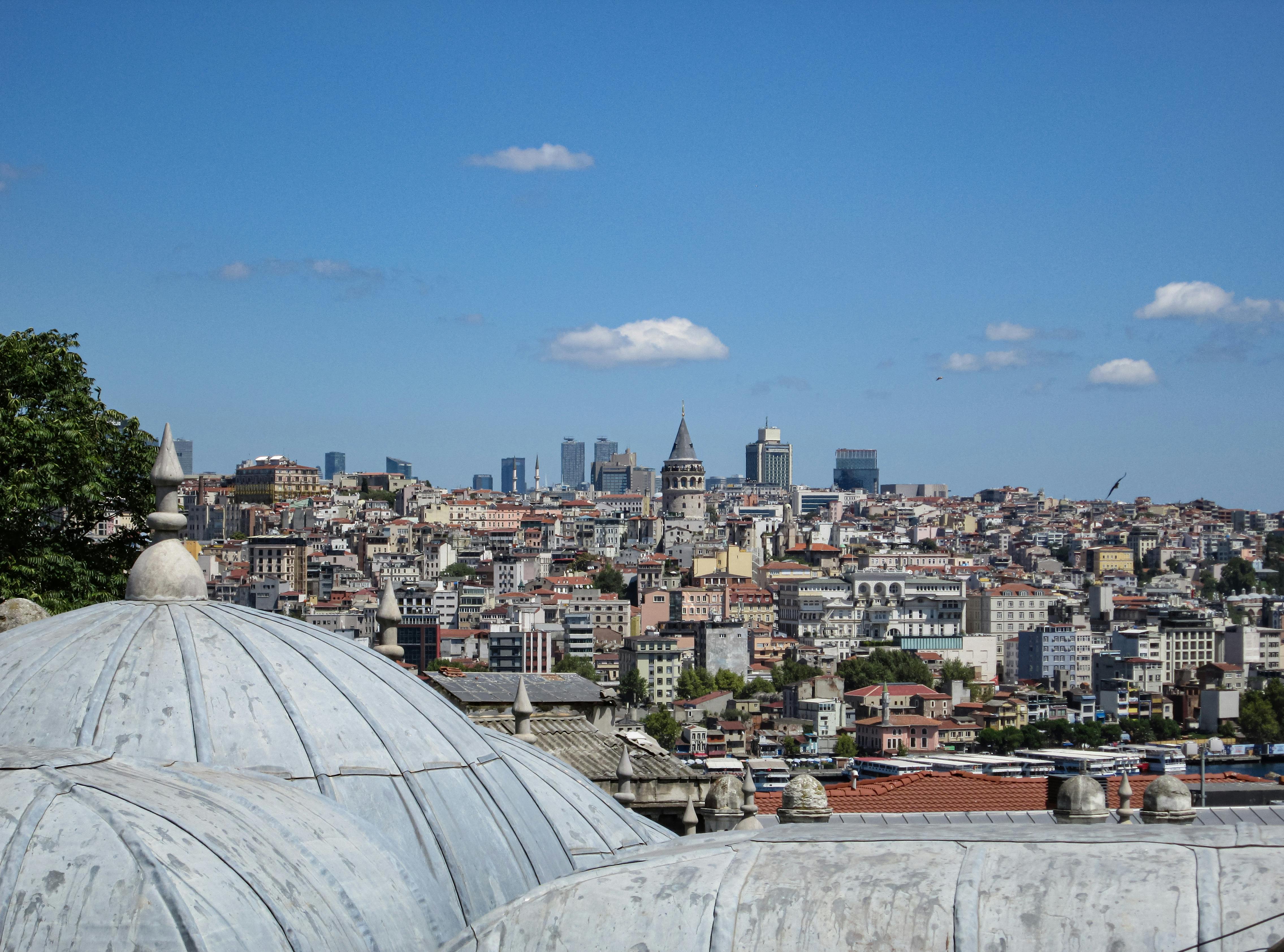 the view from the top of a building with a city in the background