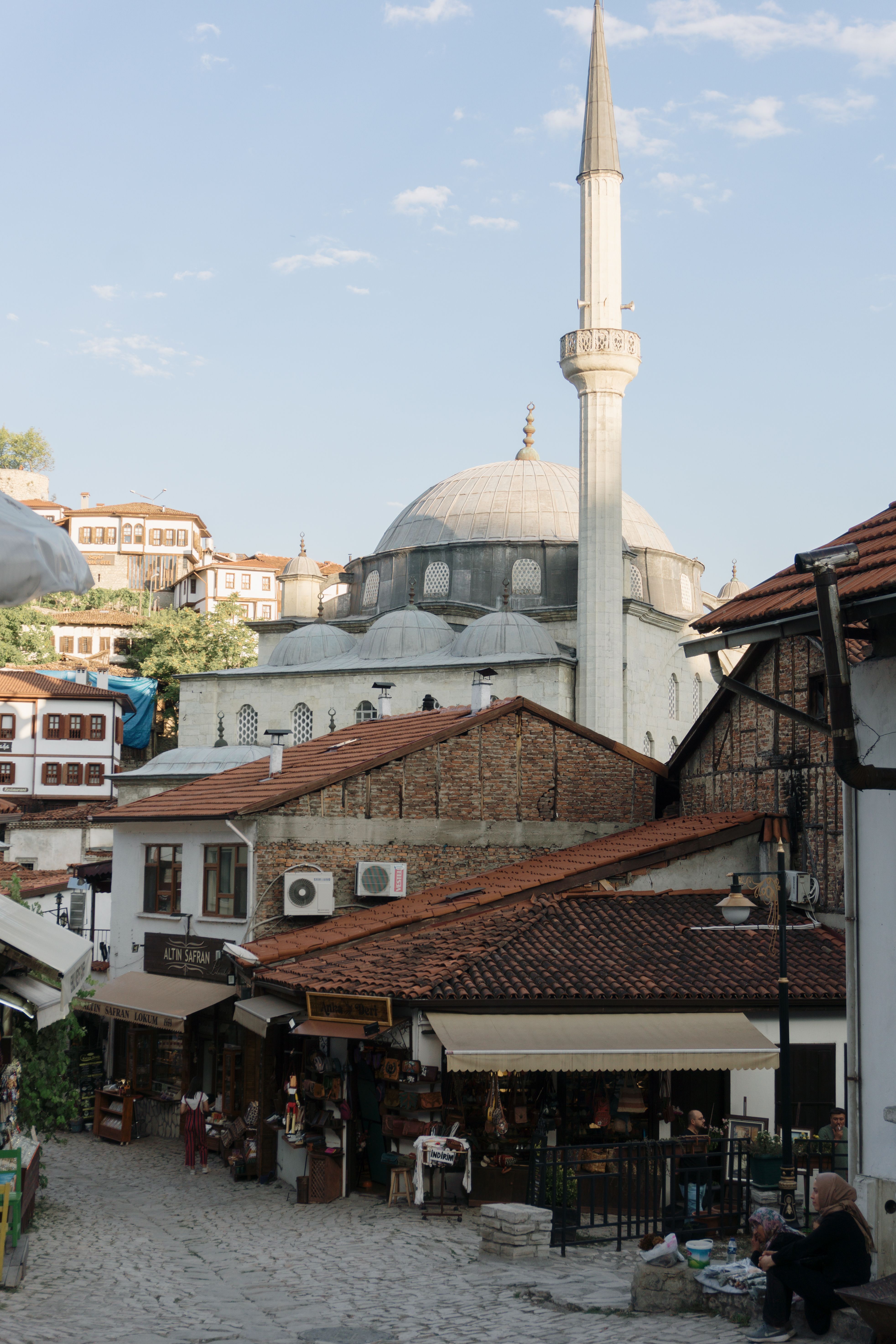 A street with a mosque in the background · Free Stock Photo