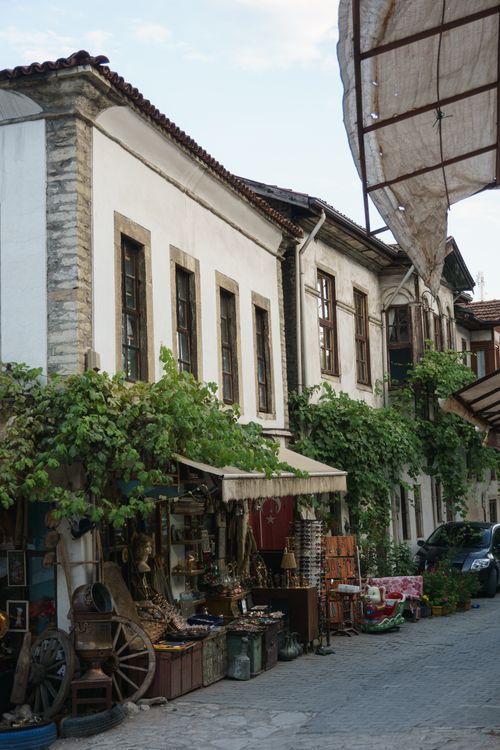 Free Explore a quaint street market filled with unique souvenirs in a historical old town setting. Stock Photo