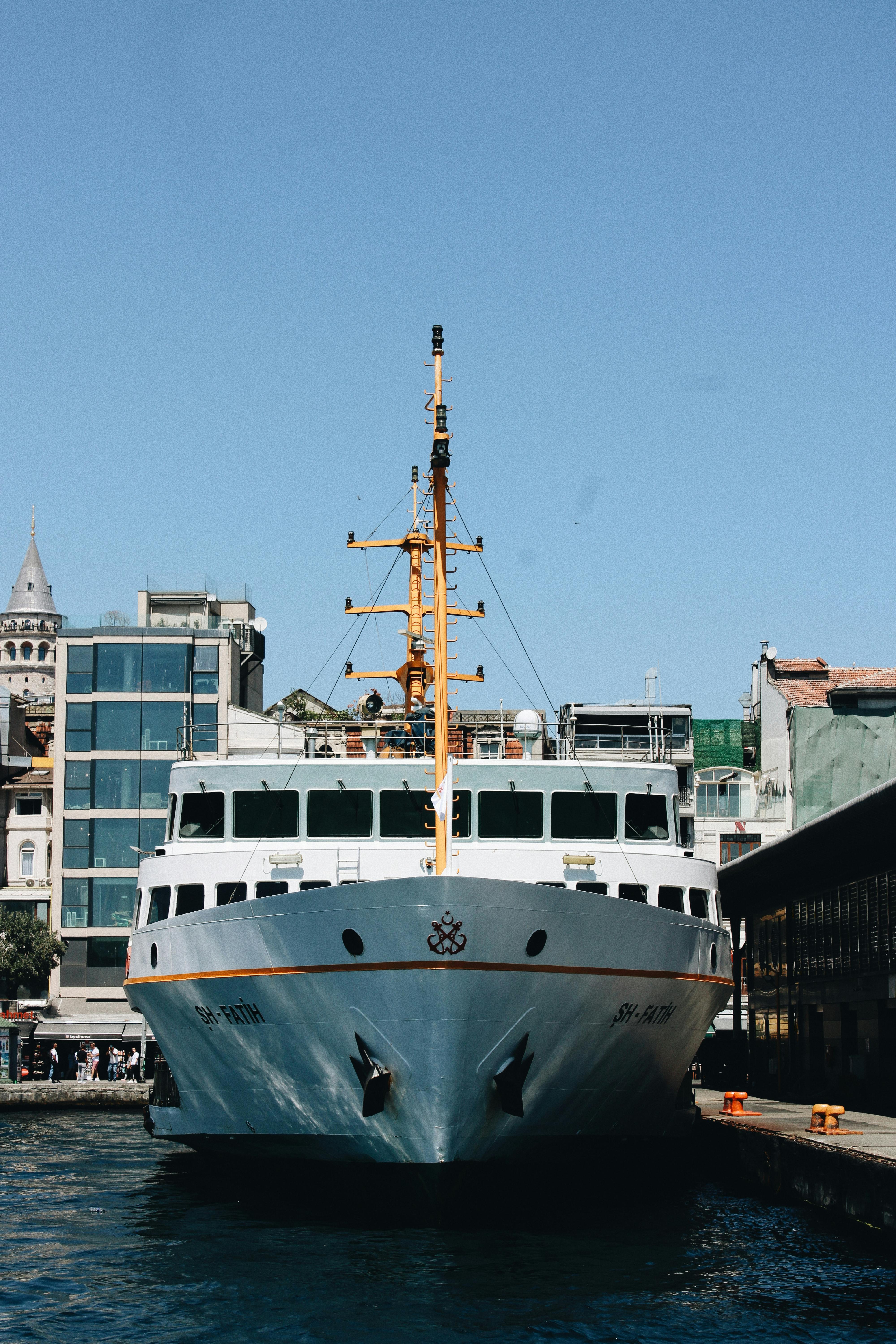 a ferry boat is docked in a harbor