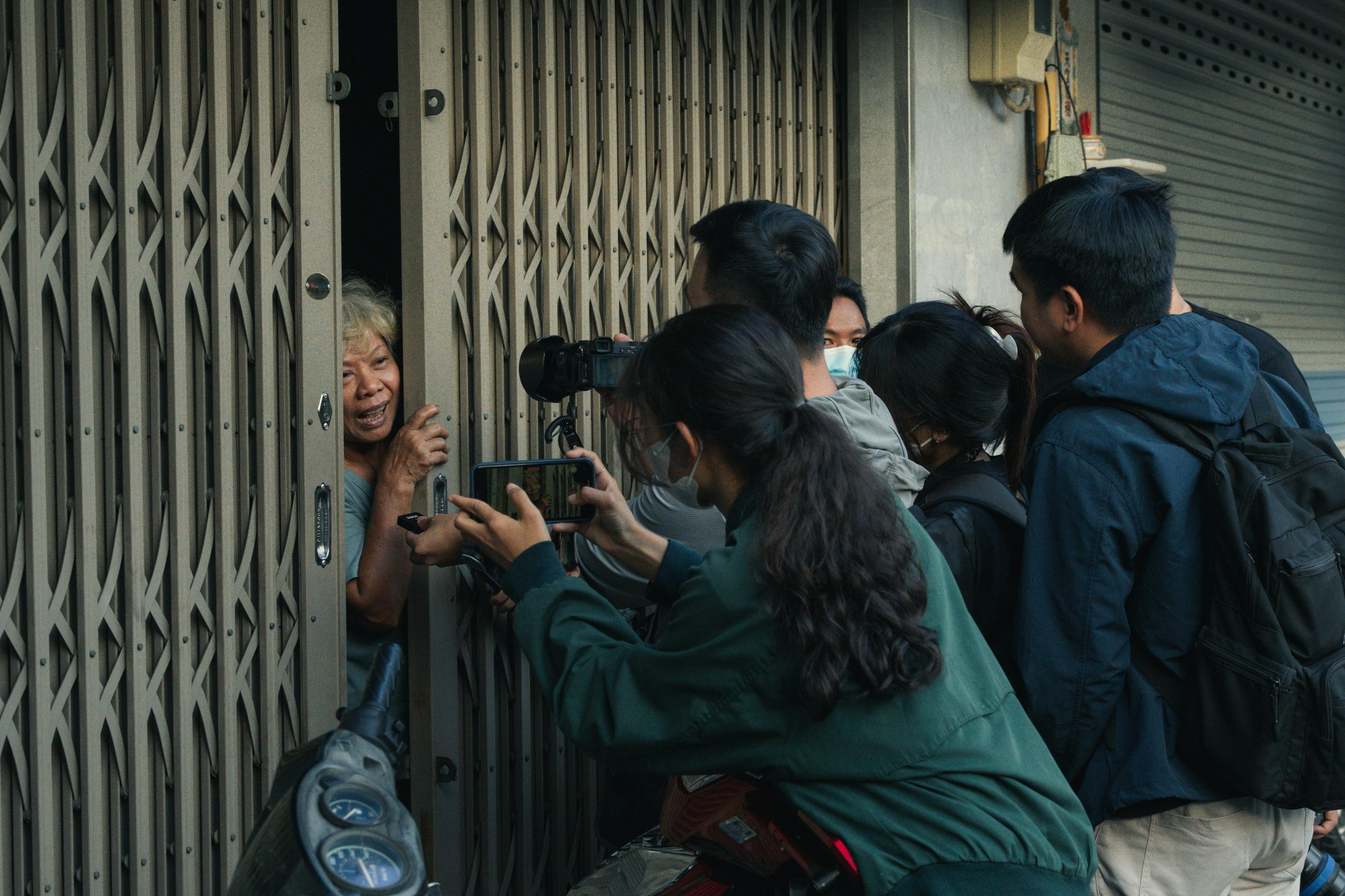 a group of people standing outside a door