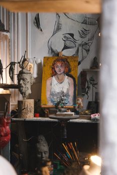 Colorful painting and sculptures in an artist's studio, showcasing creativity and craft.