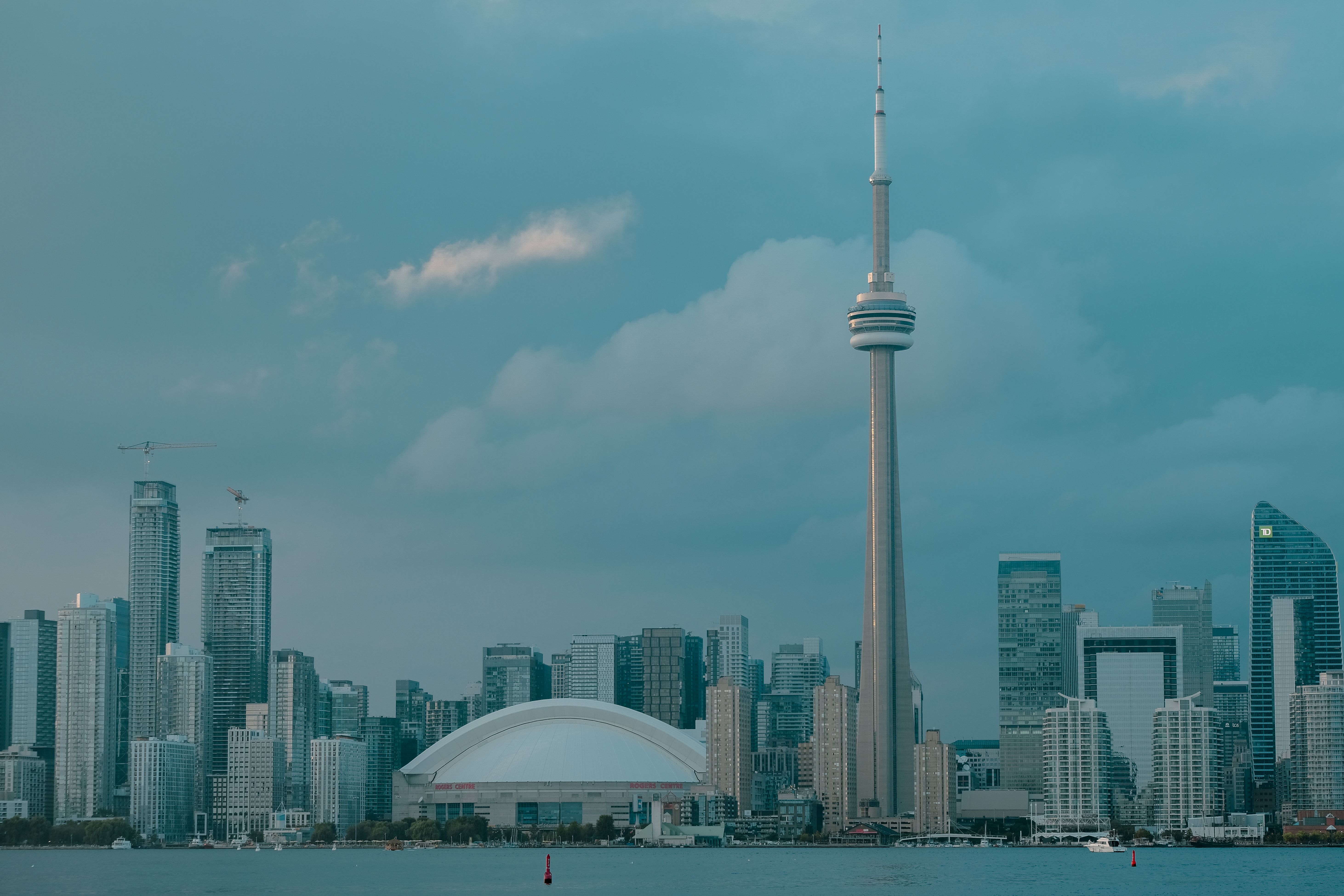 Toronto City Hall and downtown skyline reflecting the 2024 budget and property tax hike funding city services