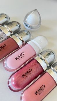 Elegant Kiko Milano lip gloss array featuring diverse pink tones and sleek packaging.