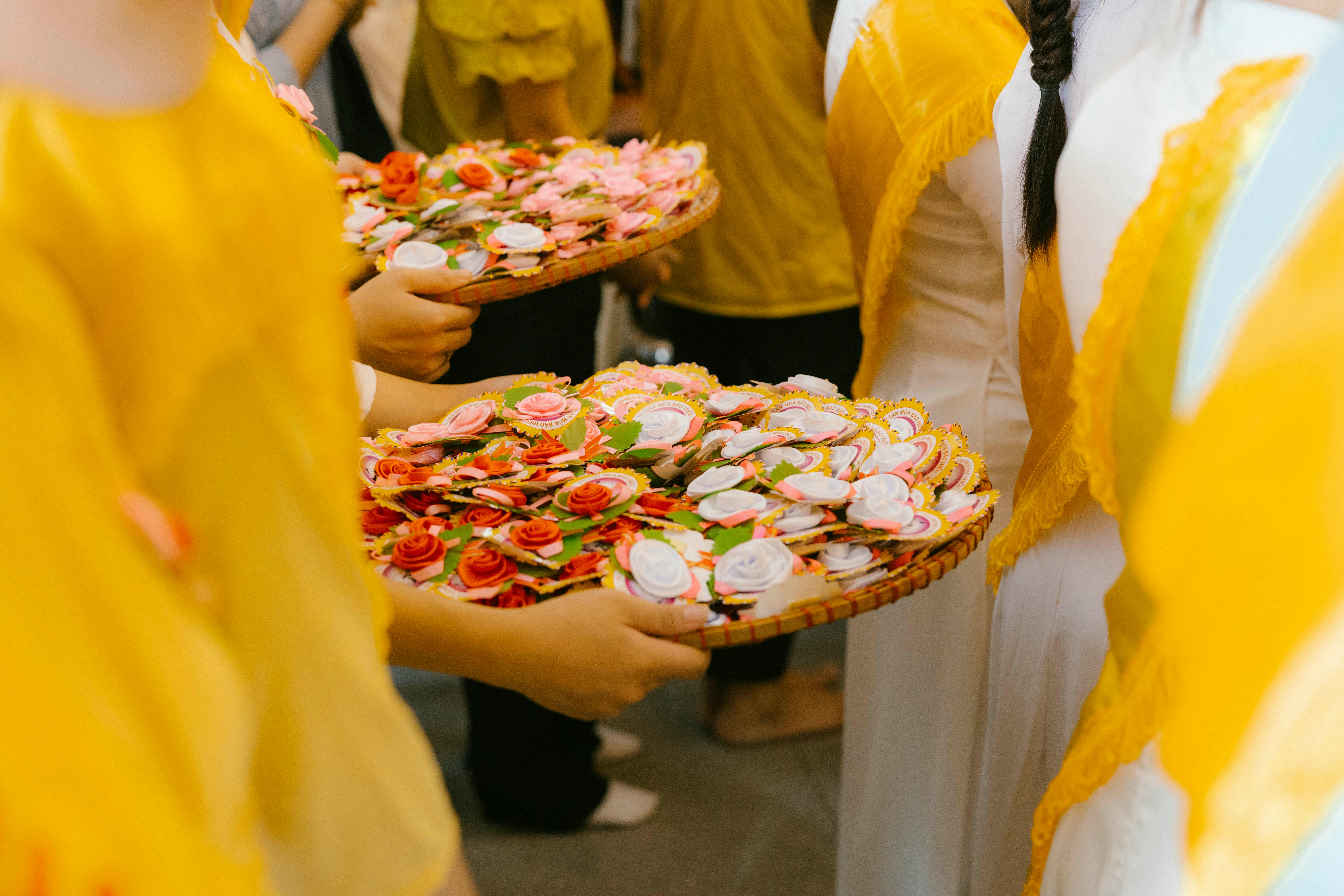 A group of people holding plates of food