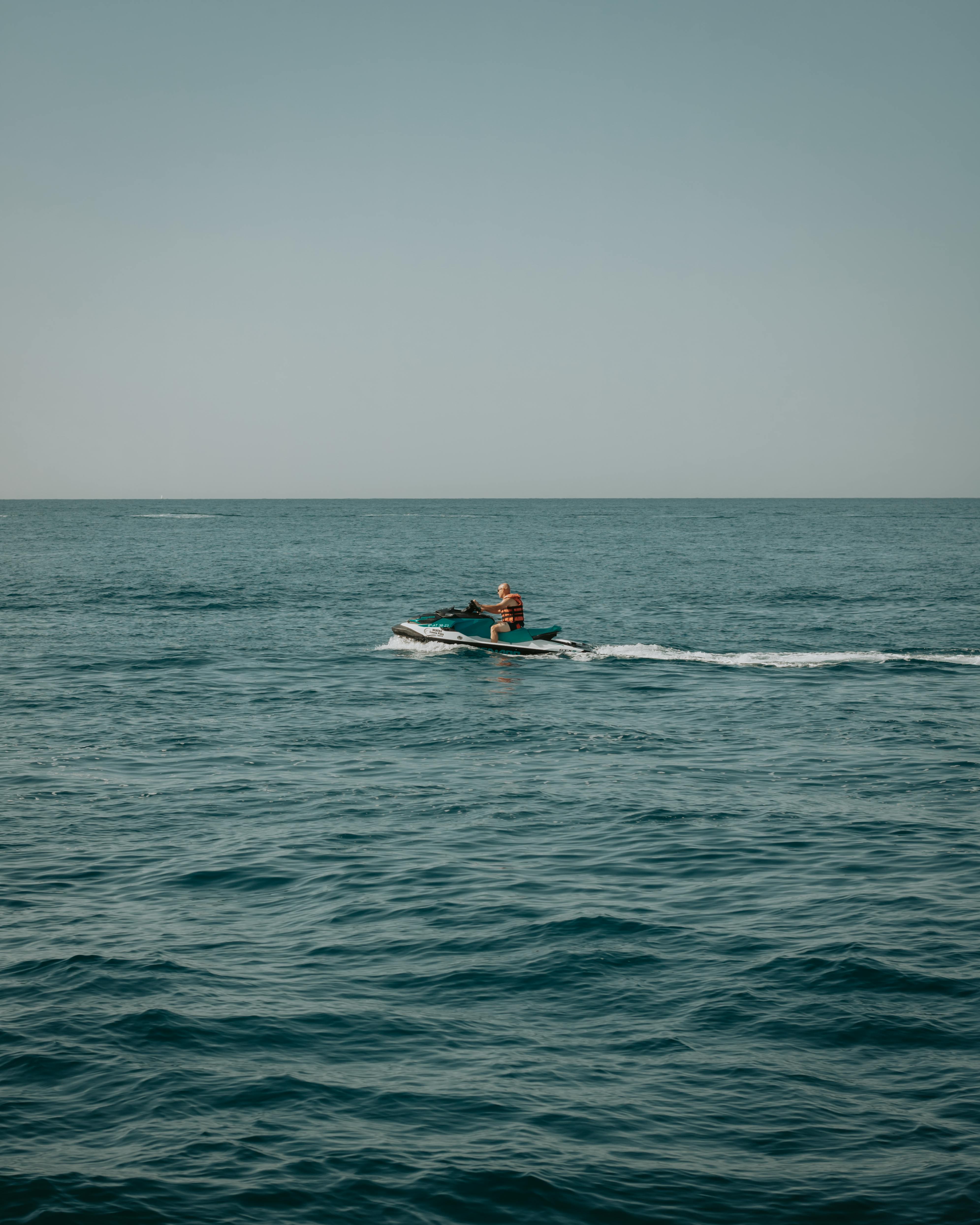 a person riding a jet ski in the ocean