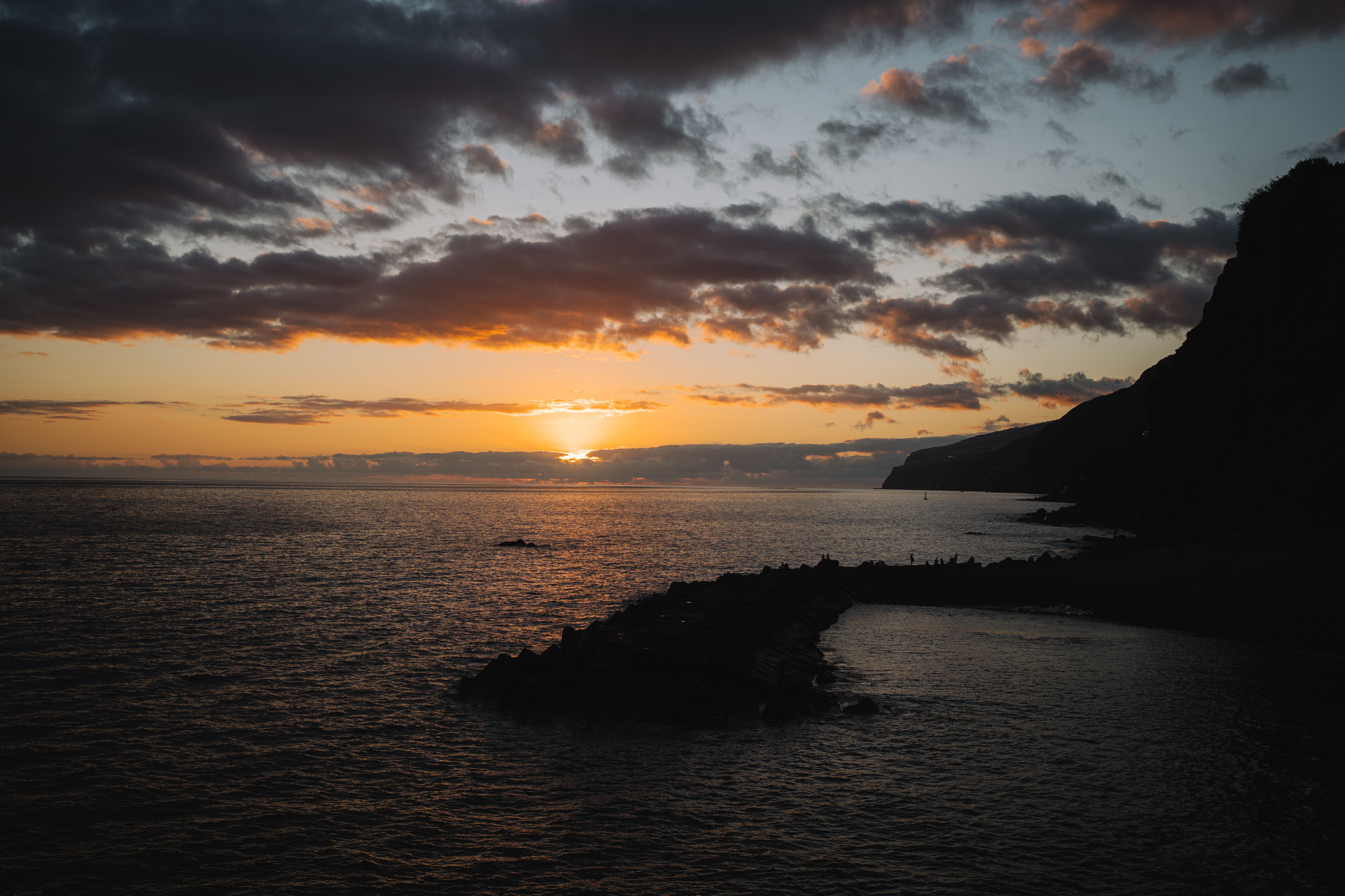 Brown and Gray Rocks on Seashore during Sunset · Free Stock Photo