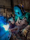 A welder is working on a piece of metal