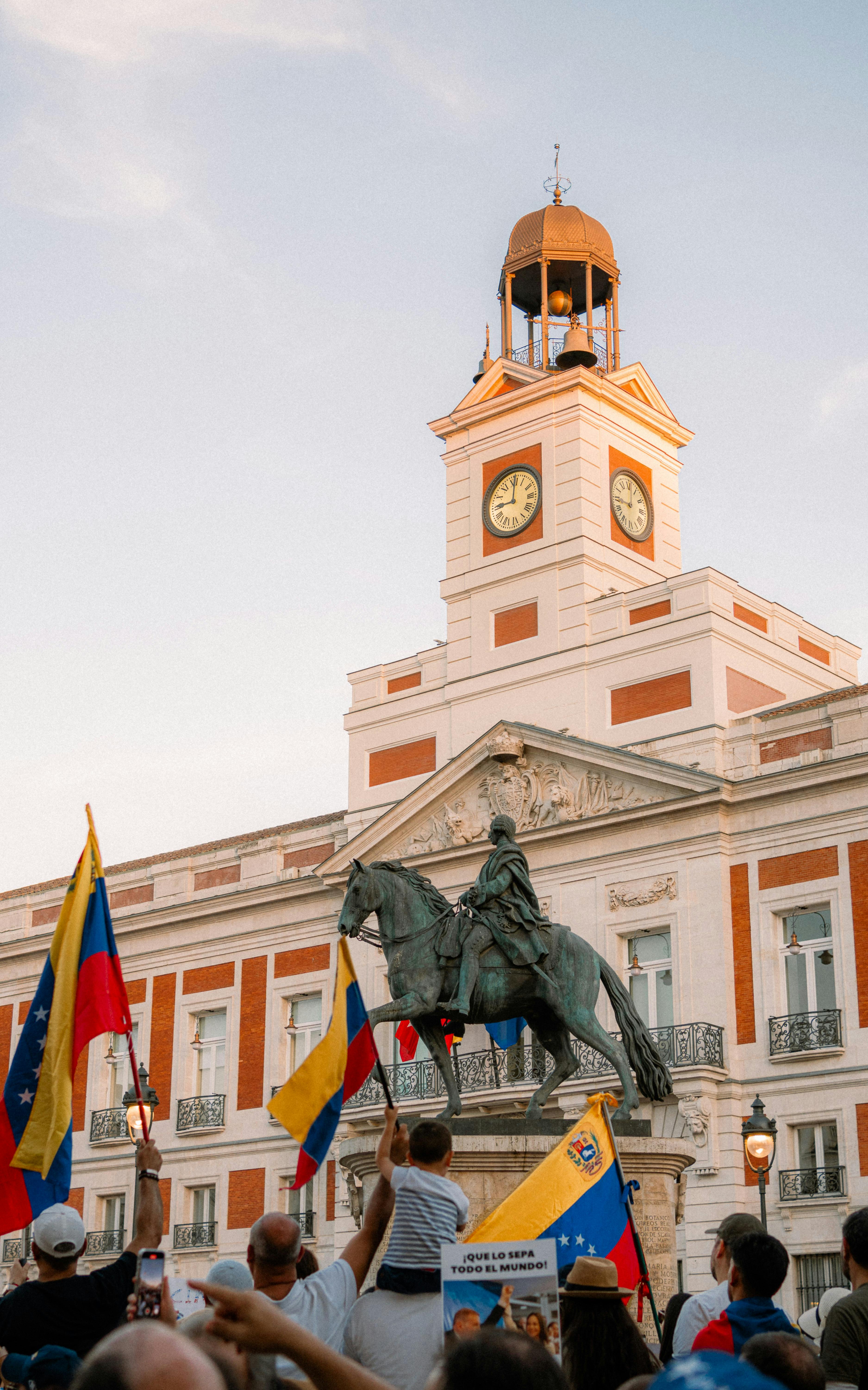 a statue of a man on horseback in front of a building