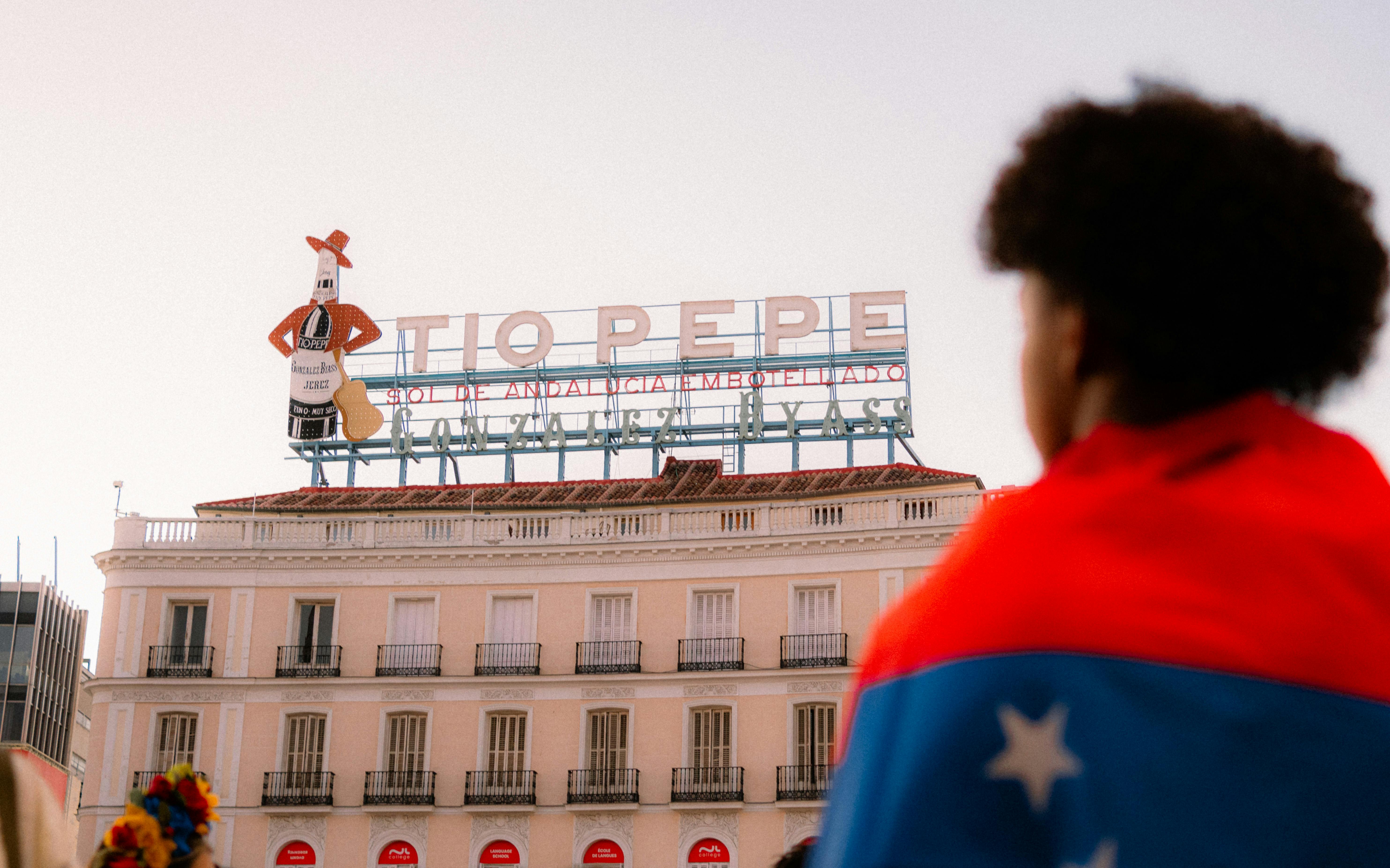 a woman with a flag in front of a building