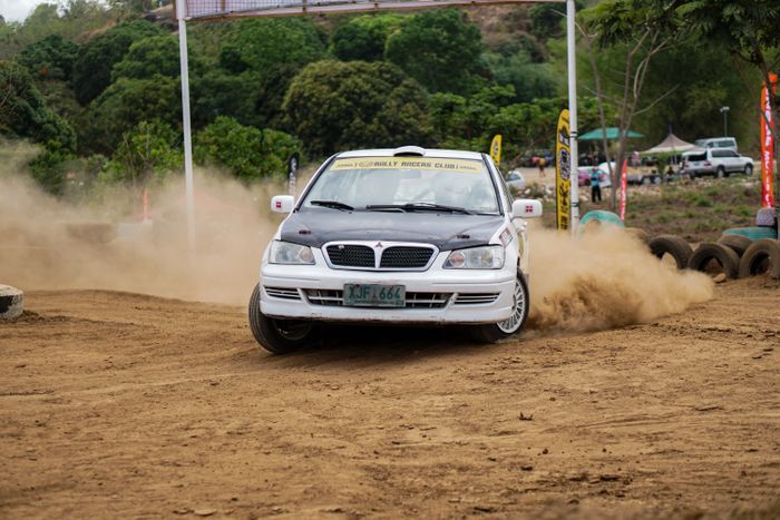 Car throwing up dust on an open track — photo by Harvey Tan Villarino on Pexels
