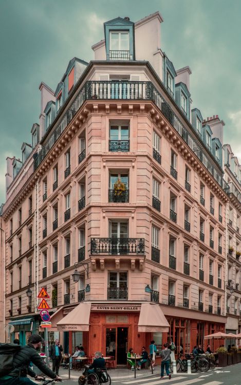 A pink building with balconies and balconies on the street · Free Stock ...