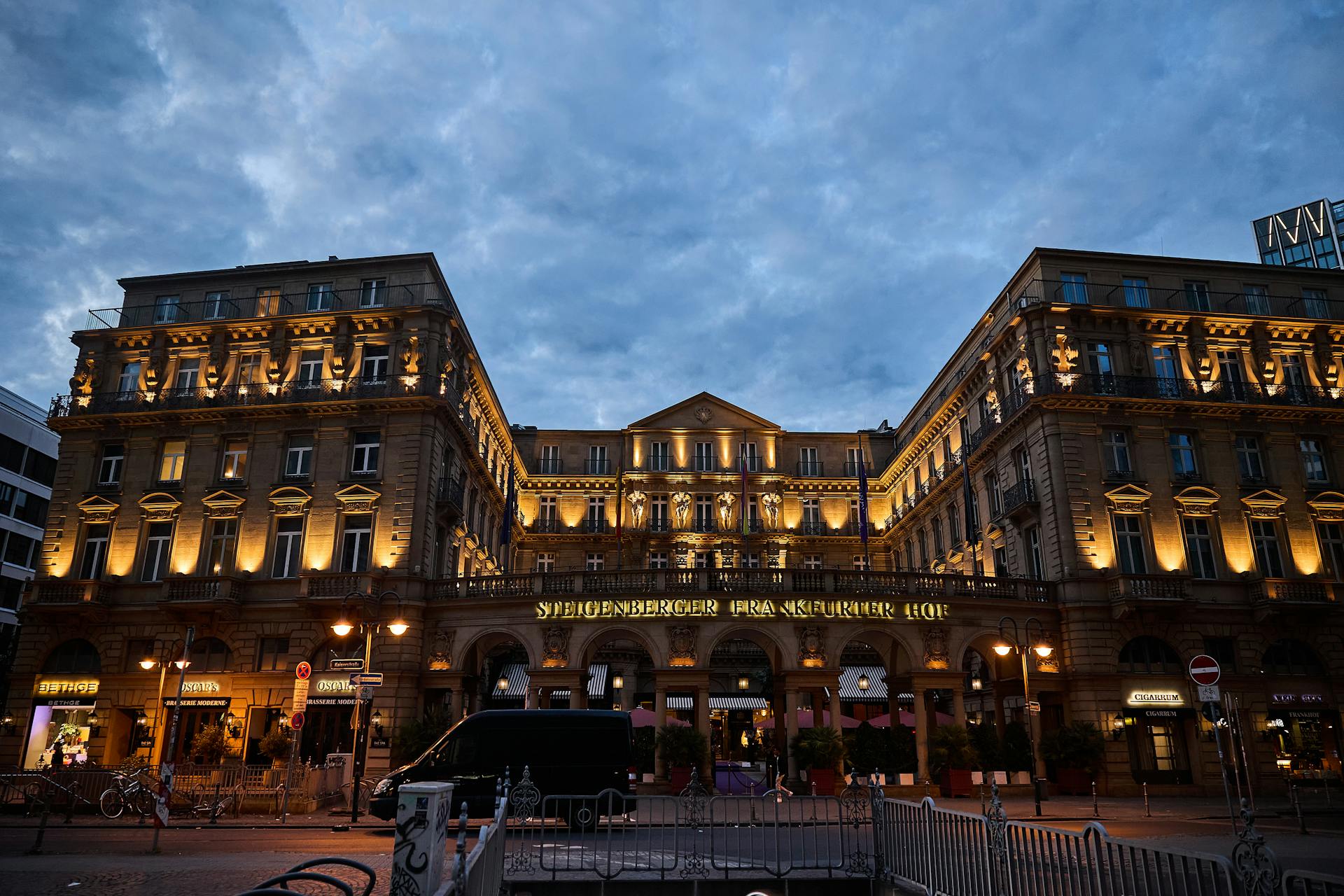 Stunning view of Steigenberger Frankfurter Hof hotel illuminated at dusk in Frankfurt, Germany.