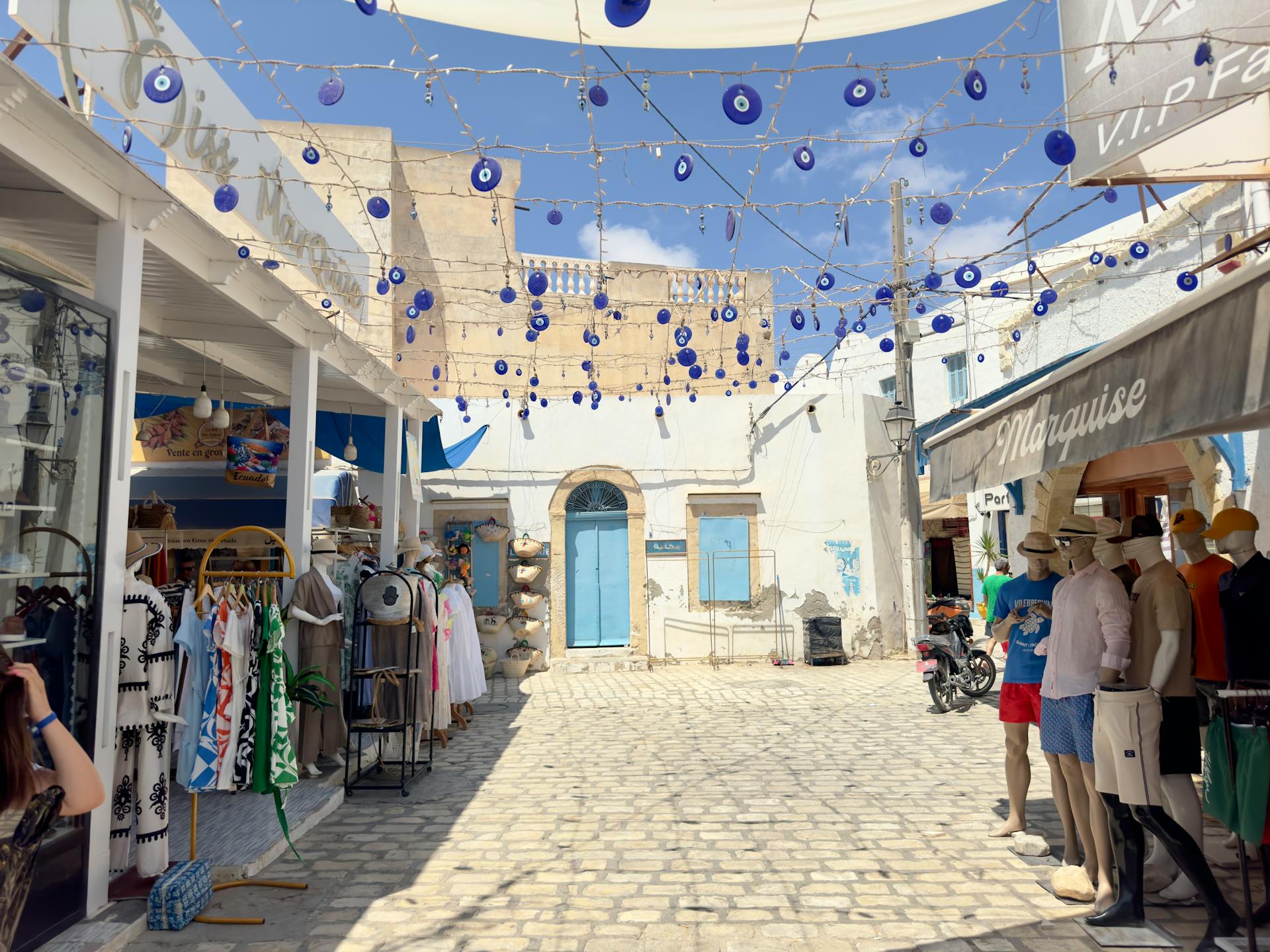 Discover the vibrant street market in Médenine Governorate, Tunisia with colorful shops and local charm.