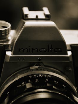 Detailed view of a vintage camera lens highlighting classic photography elements.