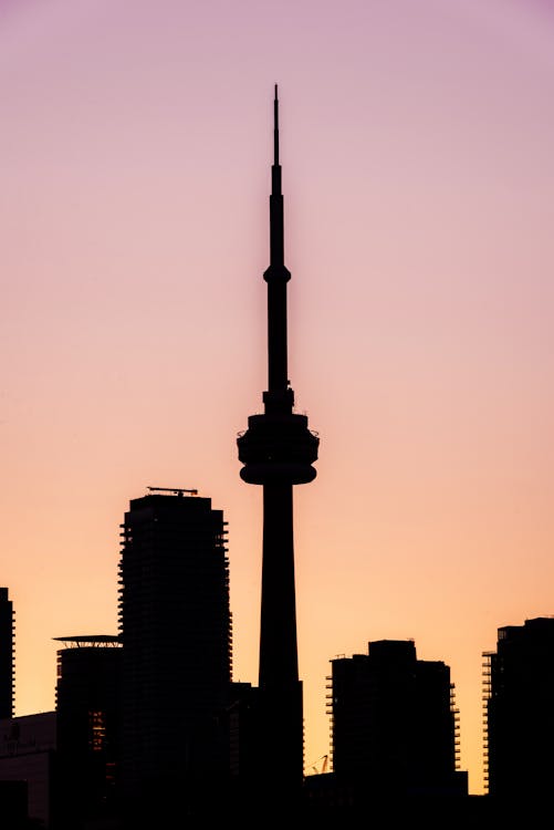 Silhouette Photo of Buildings During Dawn