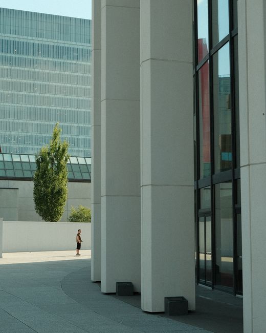Contemporary urban scene showcasing modern buildings and glass reflections.