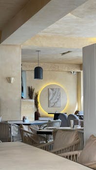 A stylish and contemporary restaurant interior with soft lighting and modern furniture.