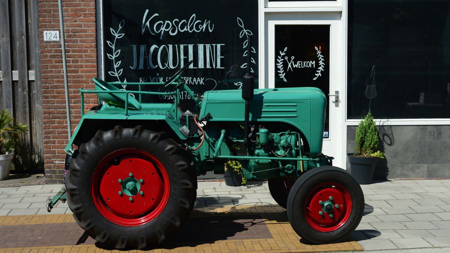 Classic tractor with red wheels