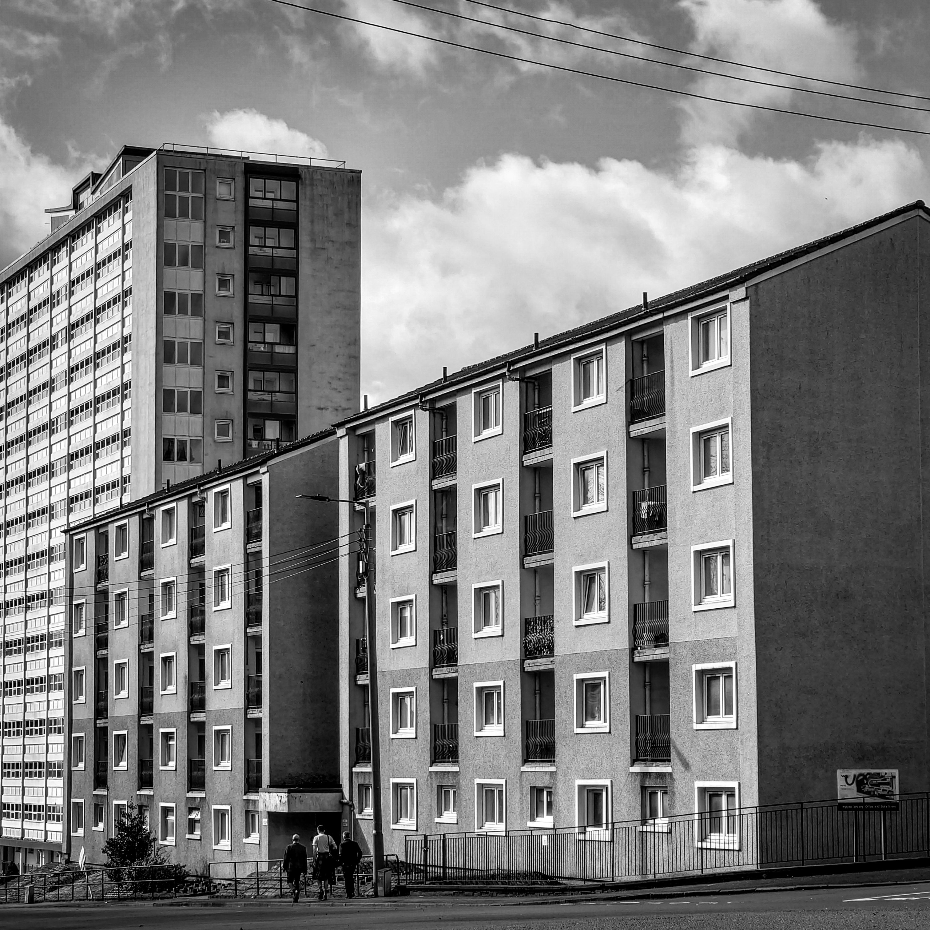 Black and white photo of two apartment buildings