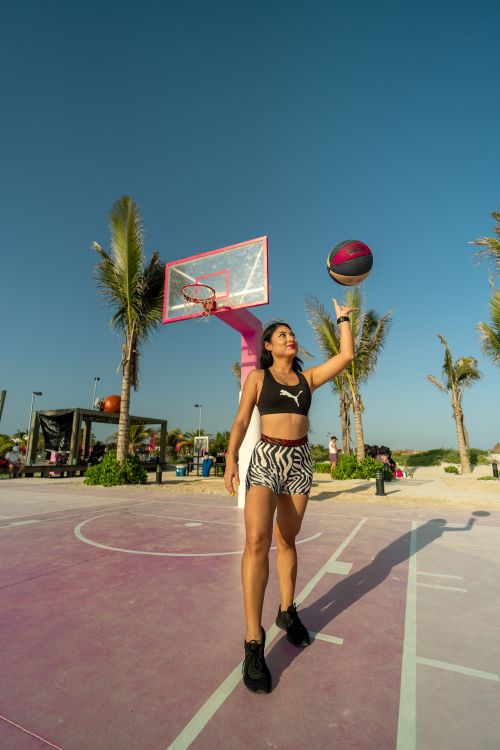 A Woman In A Bikini Holding A Basketball Free Stock Photo a-woman-in-a-bikini-holding-a-basketball-free-stock-photo