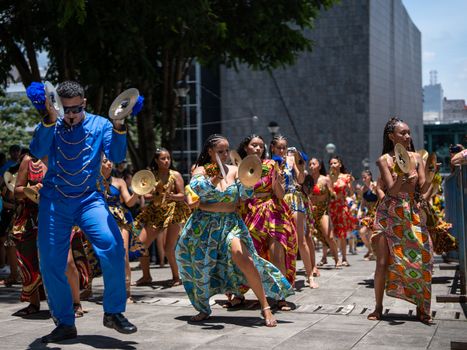Vibrant parade with traditional costumes and dancers in San José, Costa Rica, celebrating culture.
