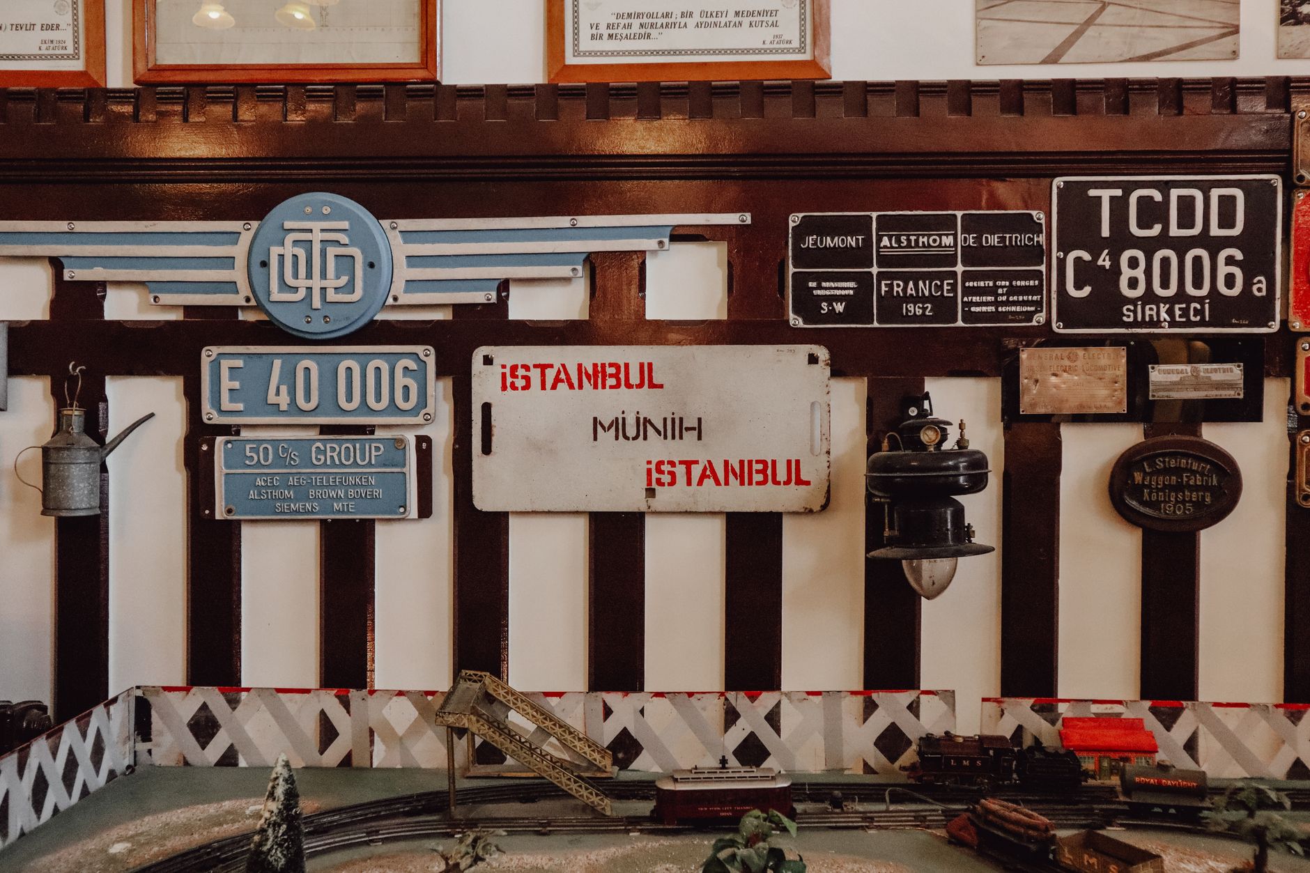 Collection of antique railway signs and decor in a museum setting in Istanbul.