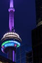 The cn tower lit up in purple and blue