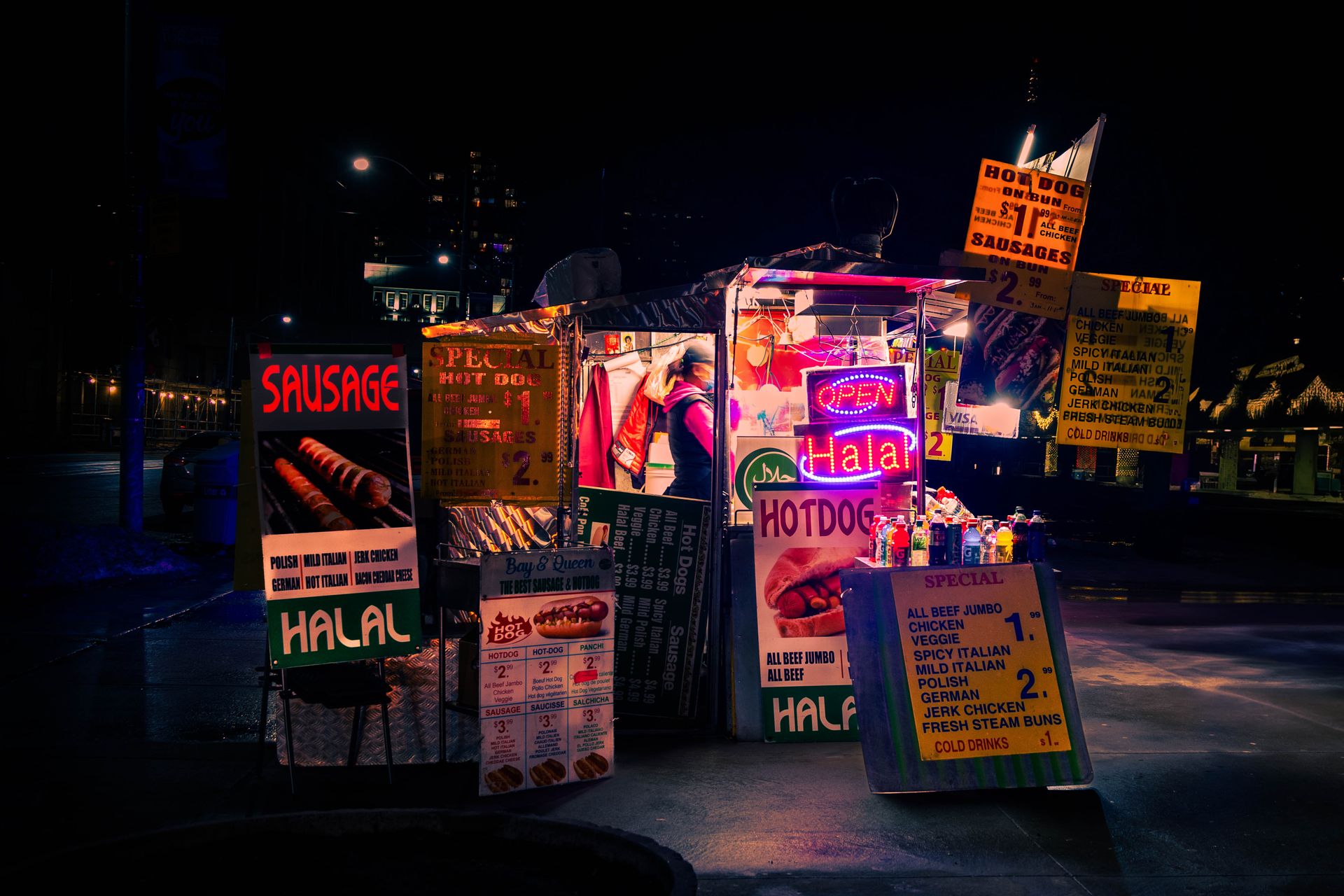 A lively night scene of a halal hotdog stand in downtown Toronto, showcasing rich neon colors and urban atmosphere.