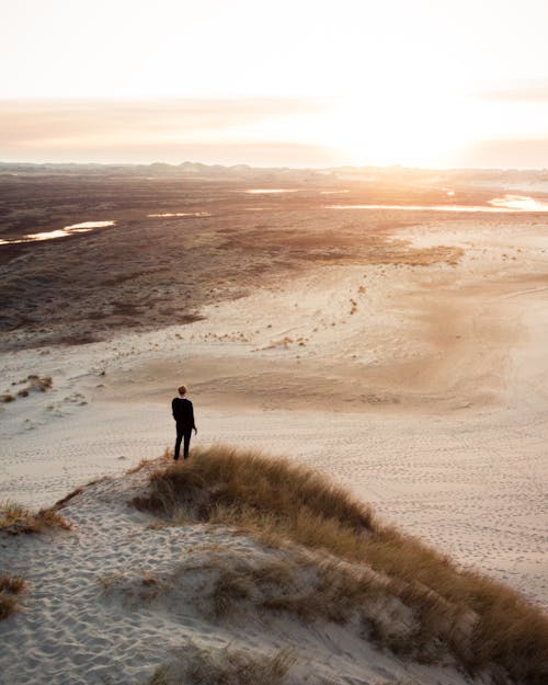 Photo Of Man Standing On A Dessert