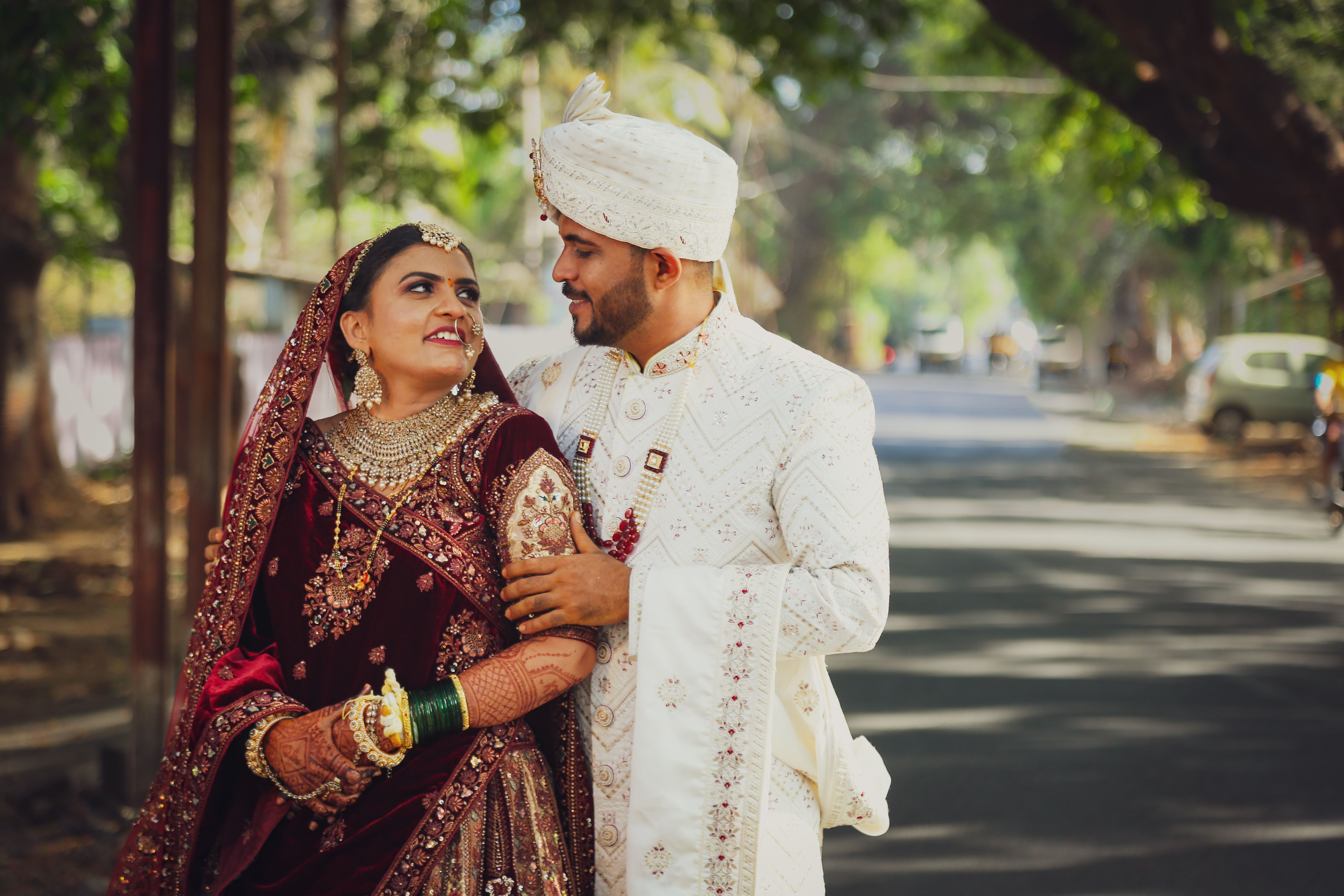 A couple in traditional indian attire pose for a photo · Free Stock Photo