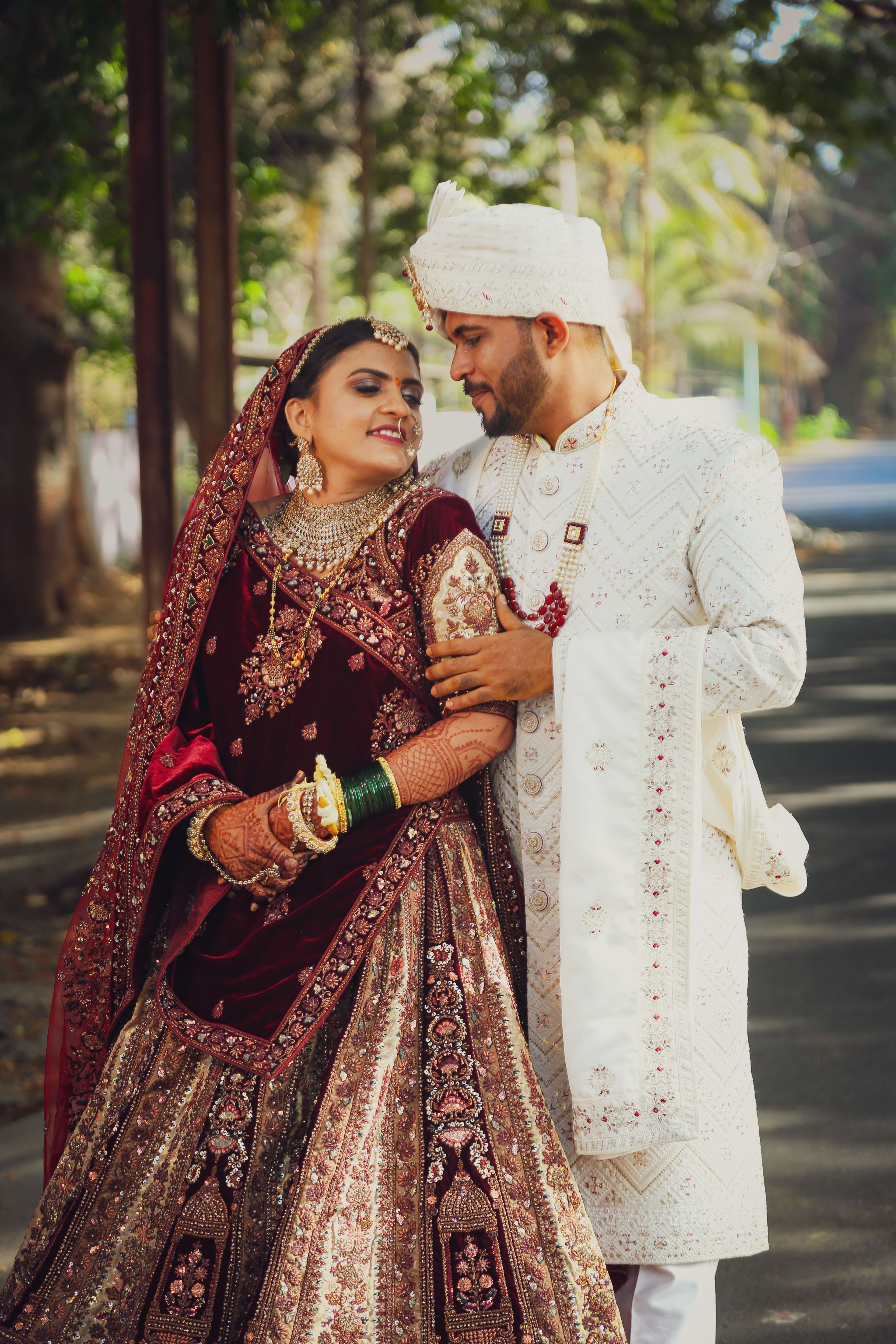 A couple in traditional indian attire pose for a photo · Free Stock Photo