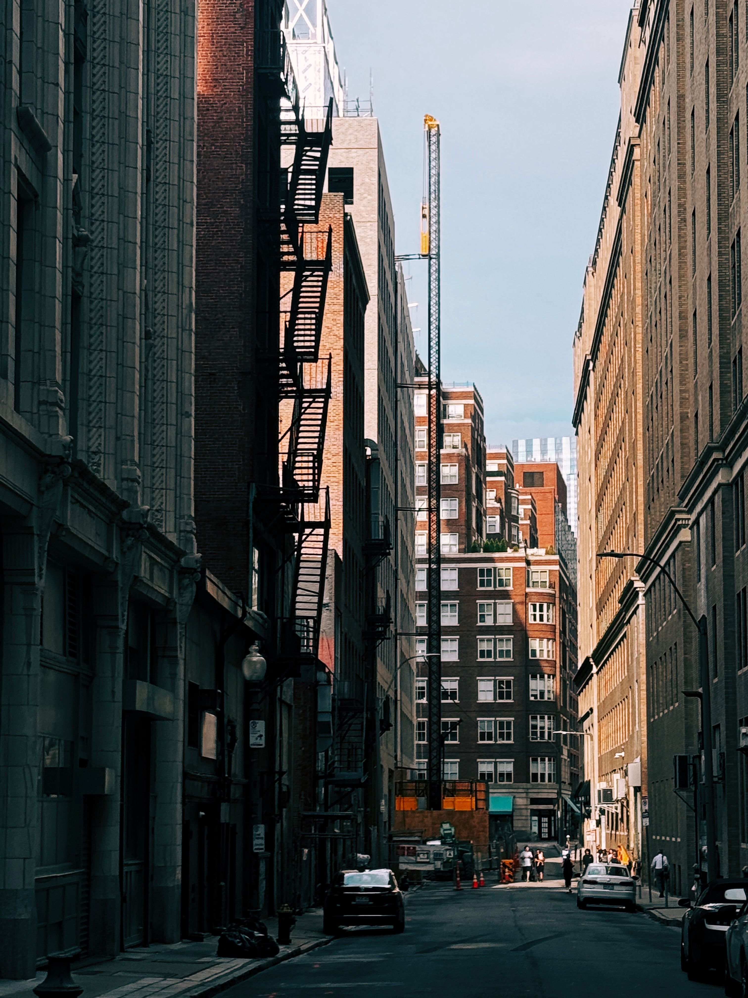 A cityscape of Boston featuring modern architecture with tall buildings and a clear sky.