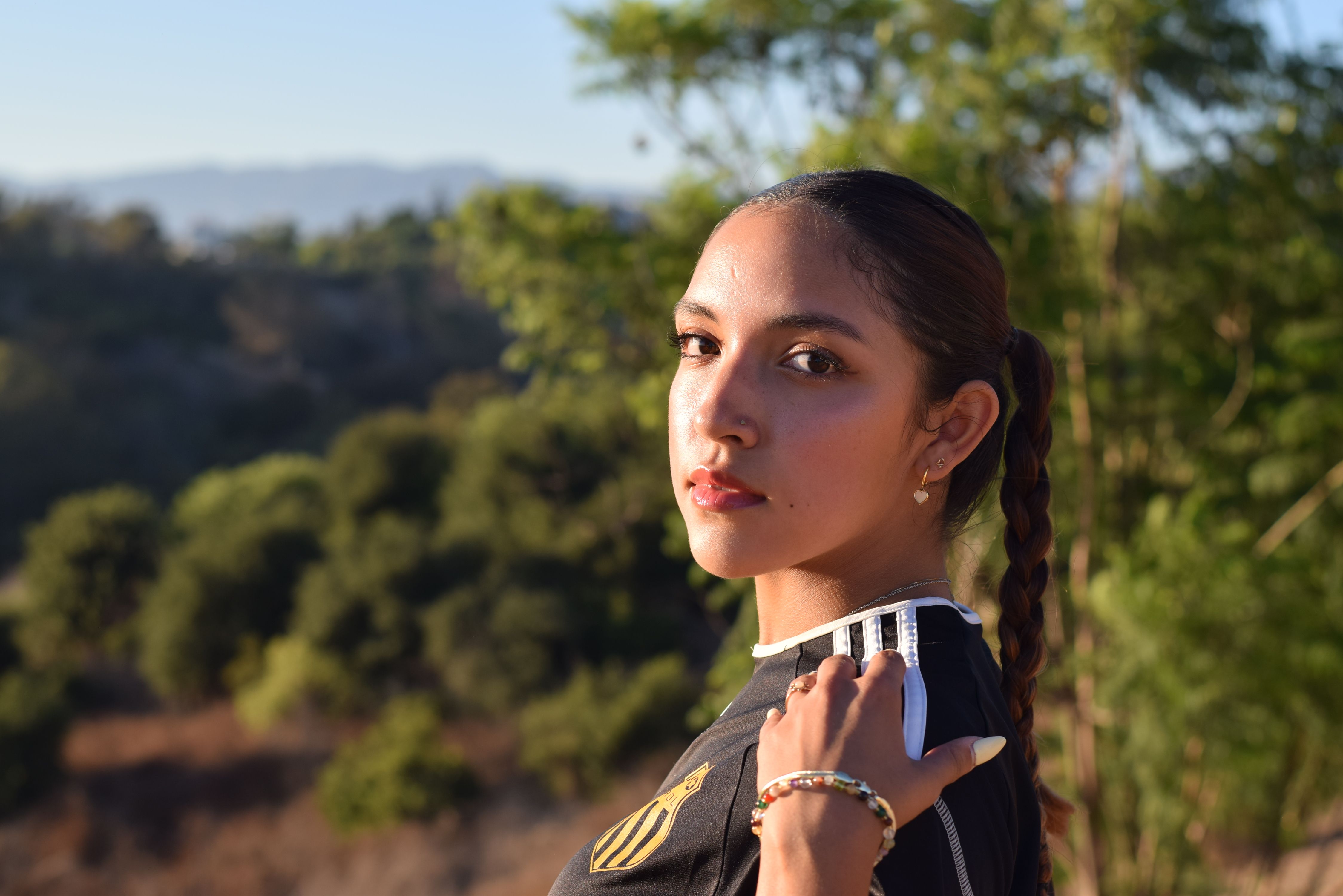 A serene portrait of a woman in the natural beauty of a Los Angeles park.
