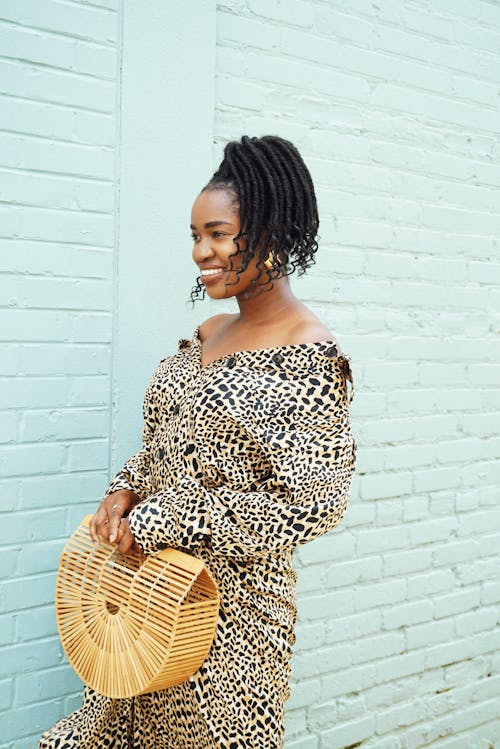 Photo of Woman Smiling While Wearing Dress