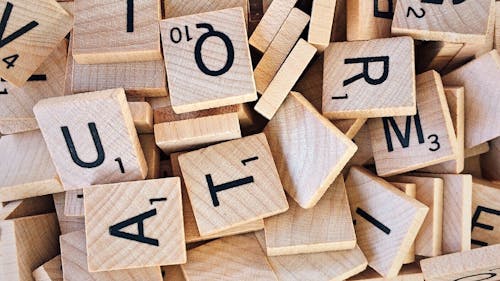 Free Pile of Scrabble Letter Pieces Stock Photo