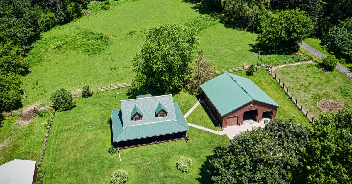 Aerial view of a countryside home in Dakota, Minnesota during summer.