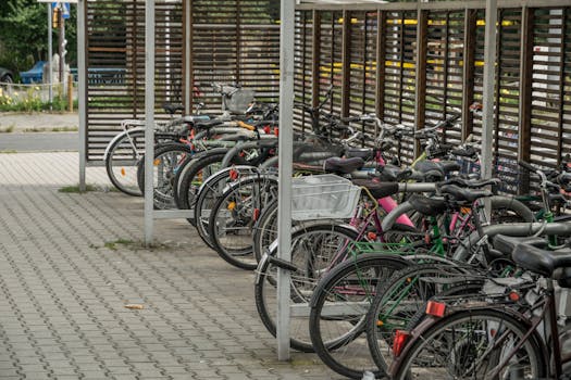 Bicycles parked in an outdoor urban lot in Wrocław, Poland.