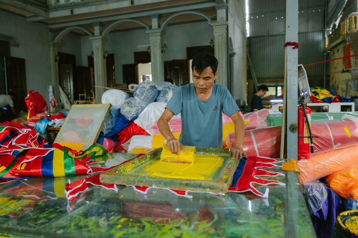 Screen printing vibrant textiles in a workshop