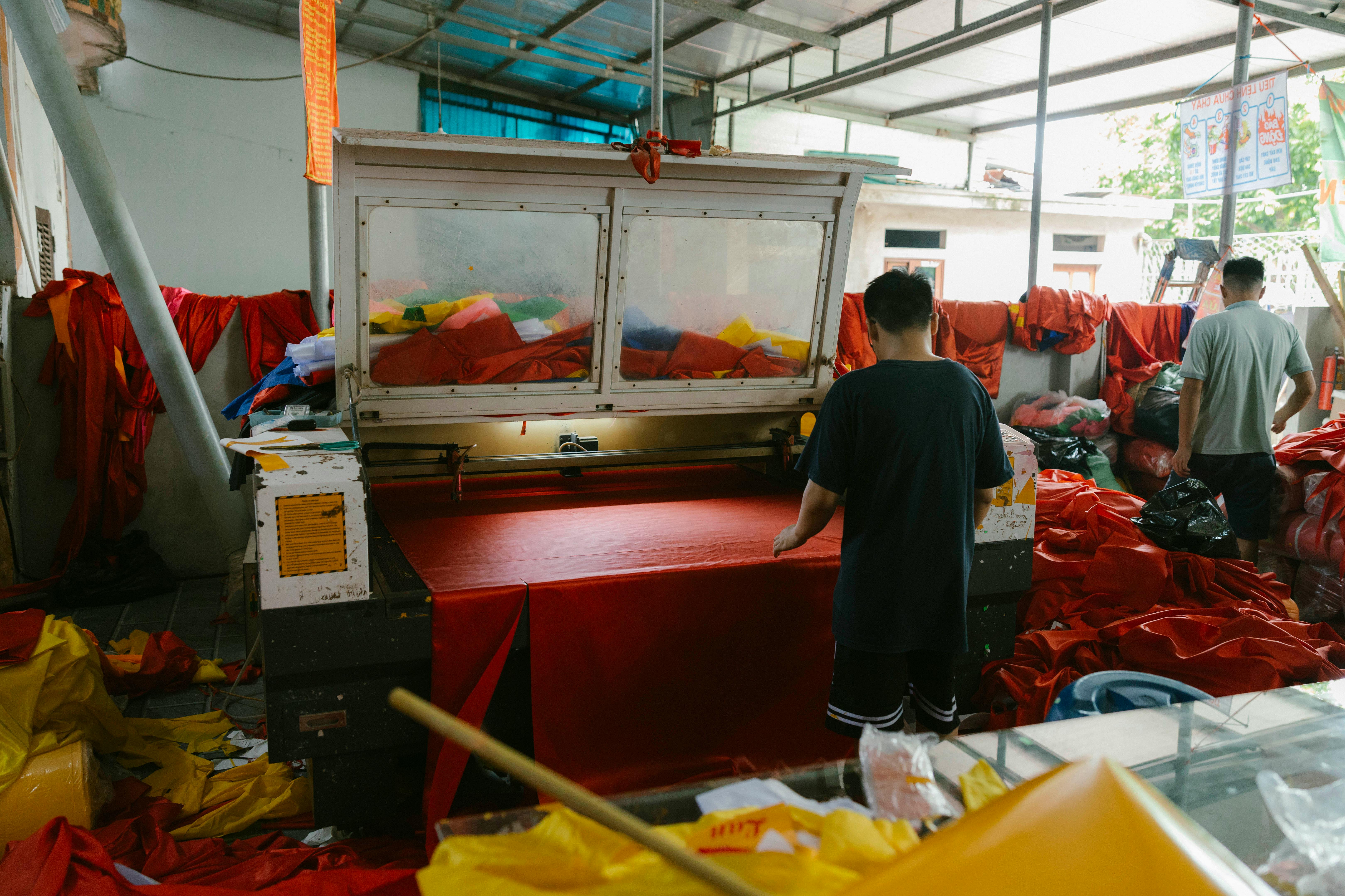 a man is working on a machine in a factory