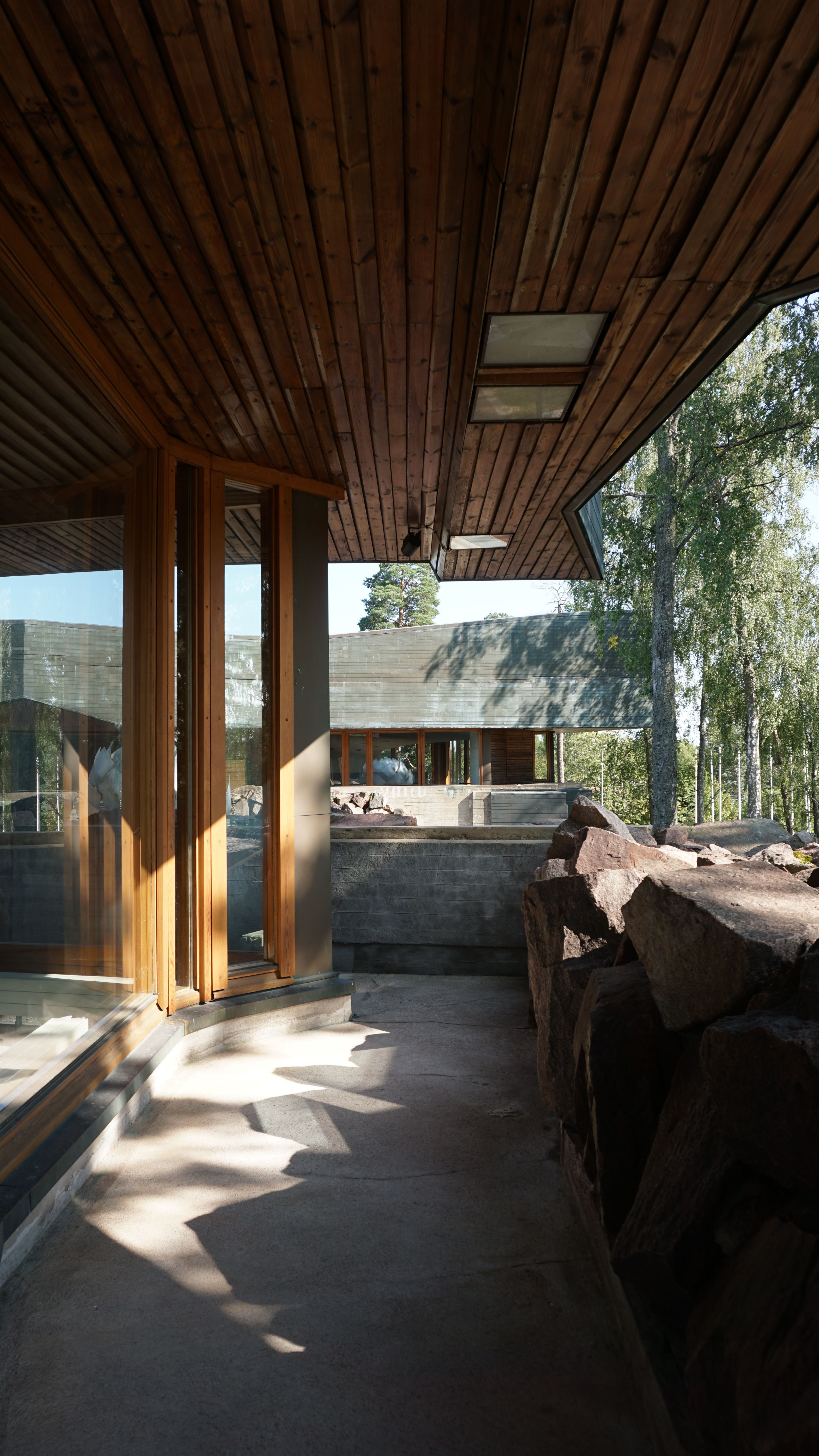 Contemporary wooden terrace design in a natural forest setting.
