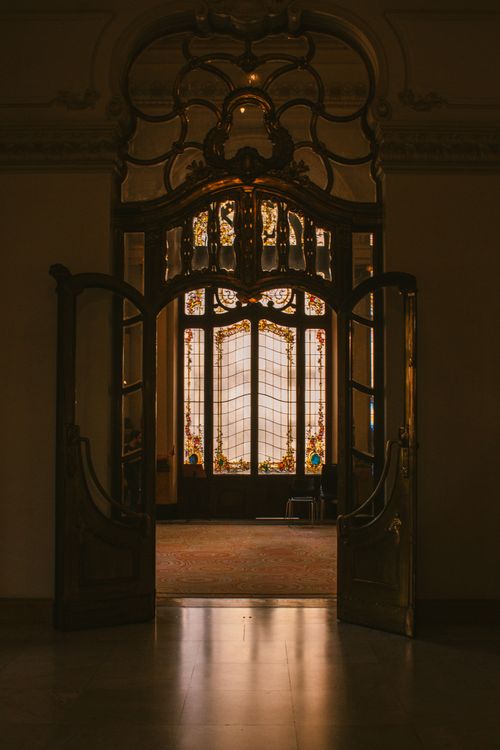 Free Intricate stained glass doors in a vintage setting, exuding timeless elegance. Stock Photo