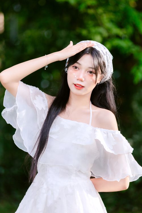 A woman in white dress posing for a photo · Free Stock Photo
